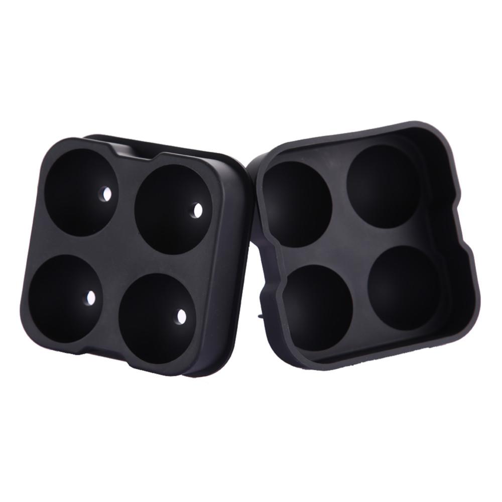 Silicone Ice Sphere Mold creating four round ice spheres for cocktails, showcasing elegant design and functionality.