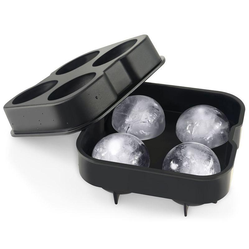 Silicone Ice Sphere Mold creating four round ice spheres for cocktails, showcasing elegant design and functionality.