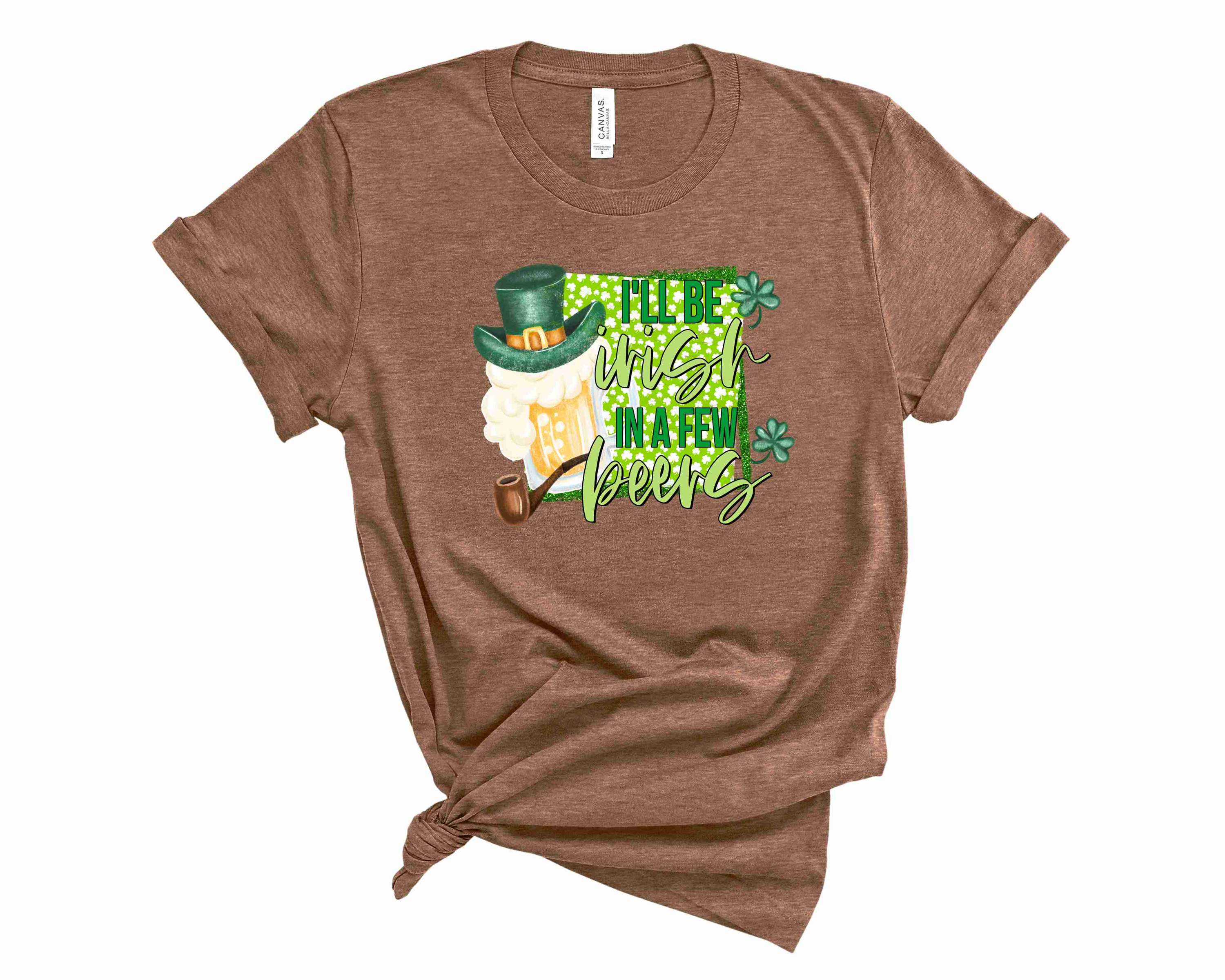 A unisex graphic tee featuring the phrase 'I'll be Irish in a few beers' in bold lettering, perfect for casual wear.