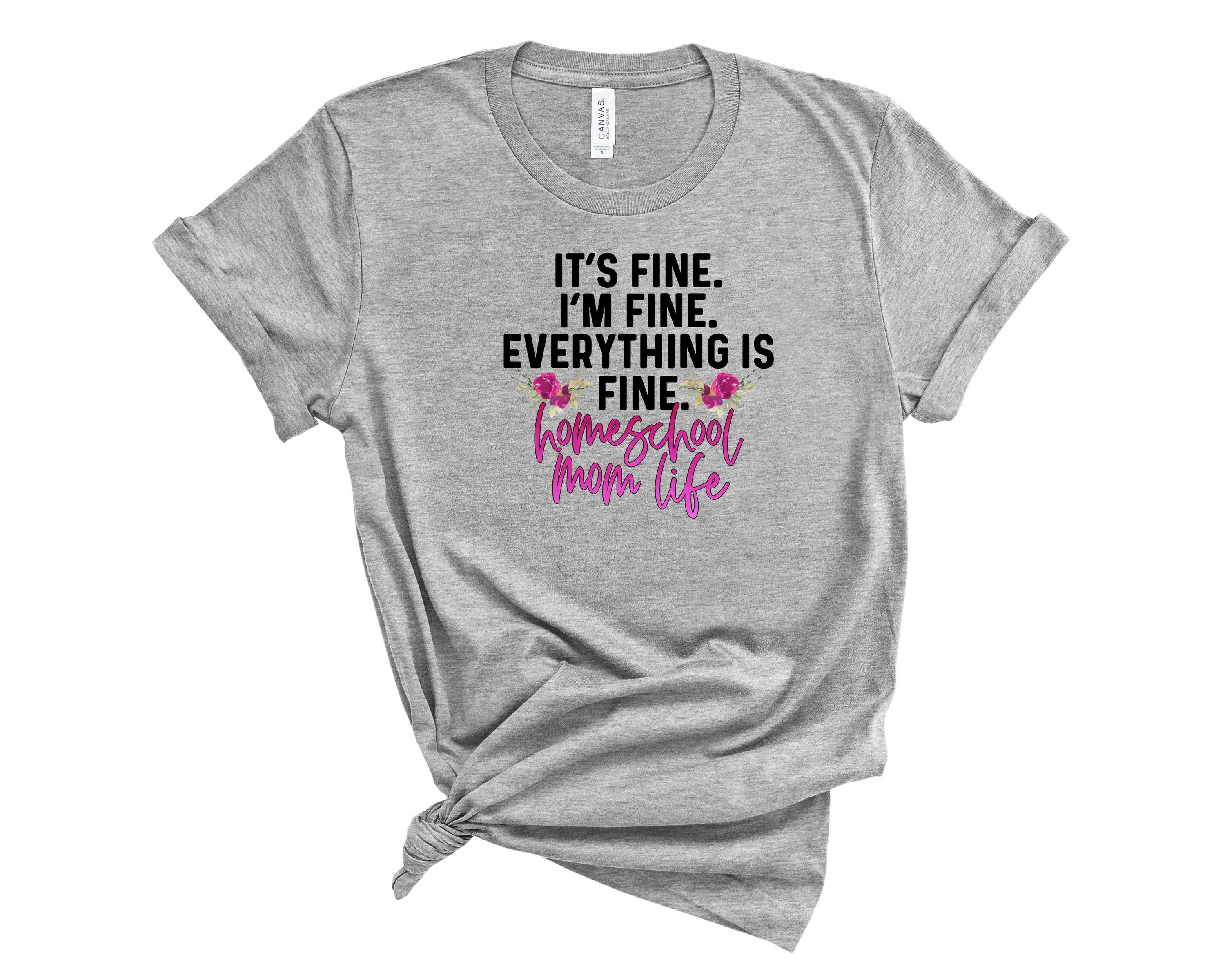 A stylish unisex graphic tee featuring the phrase 'Its Fine Homeschool Mom Life', perfect for homeschooling moms.