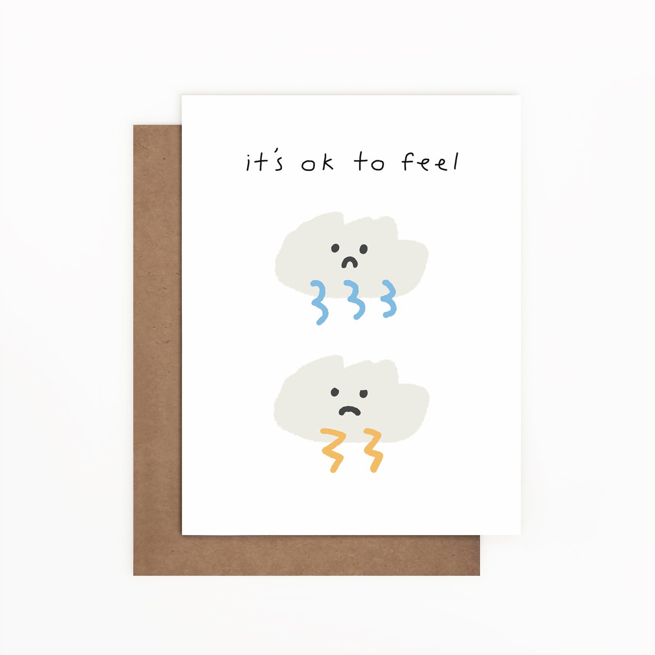 Uplifting illustrated sympathy card titled 'It's Ok to Feel' with a Kraft envelope, showcasing a comforting design.