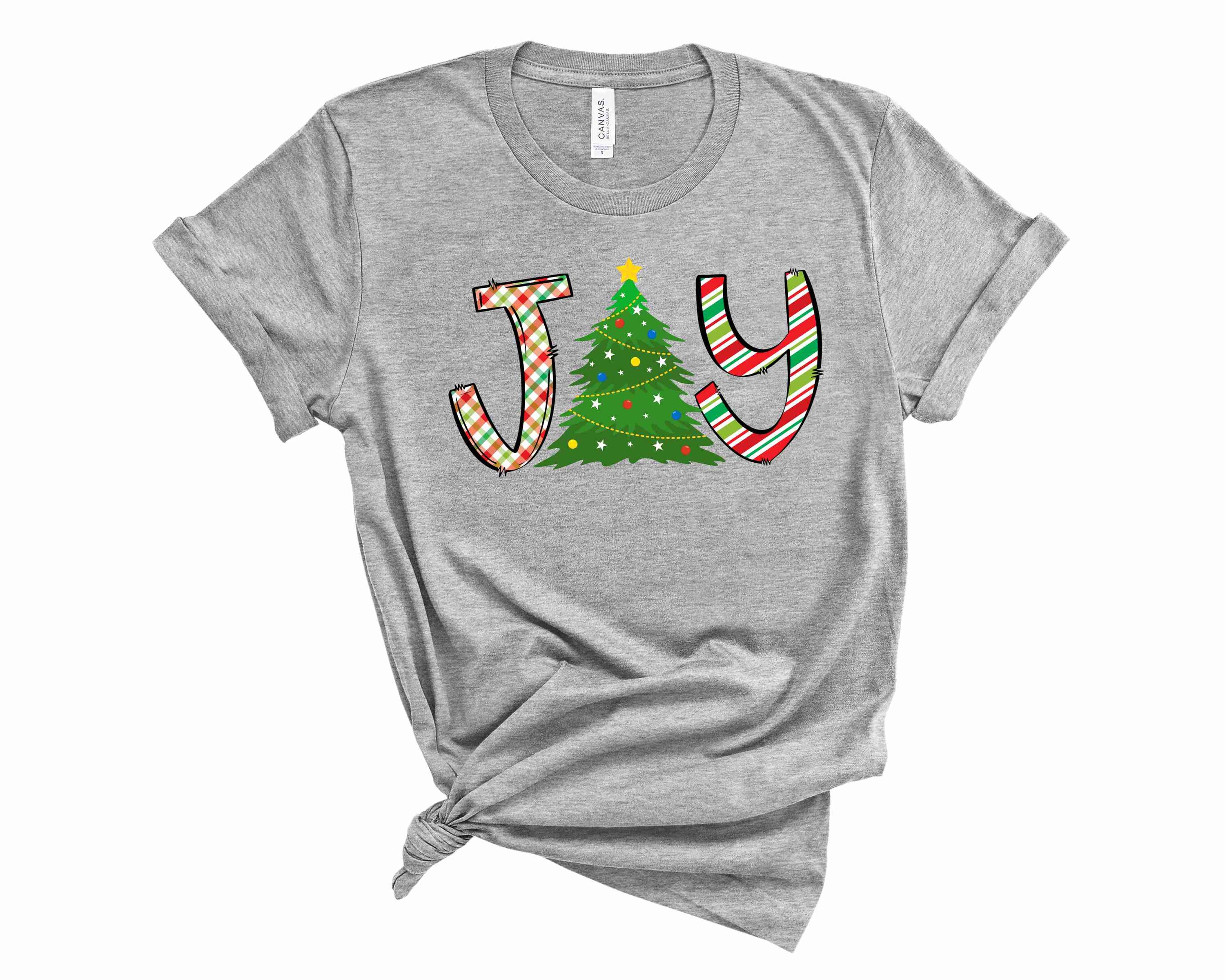 Joy Christmas Tree graphic tee featuring a vibrant tree design on a soft unisex t-shirt.