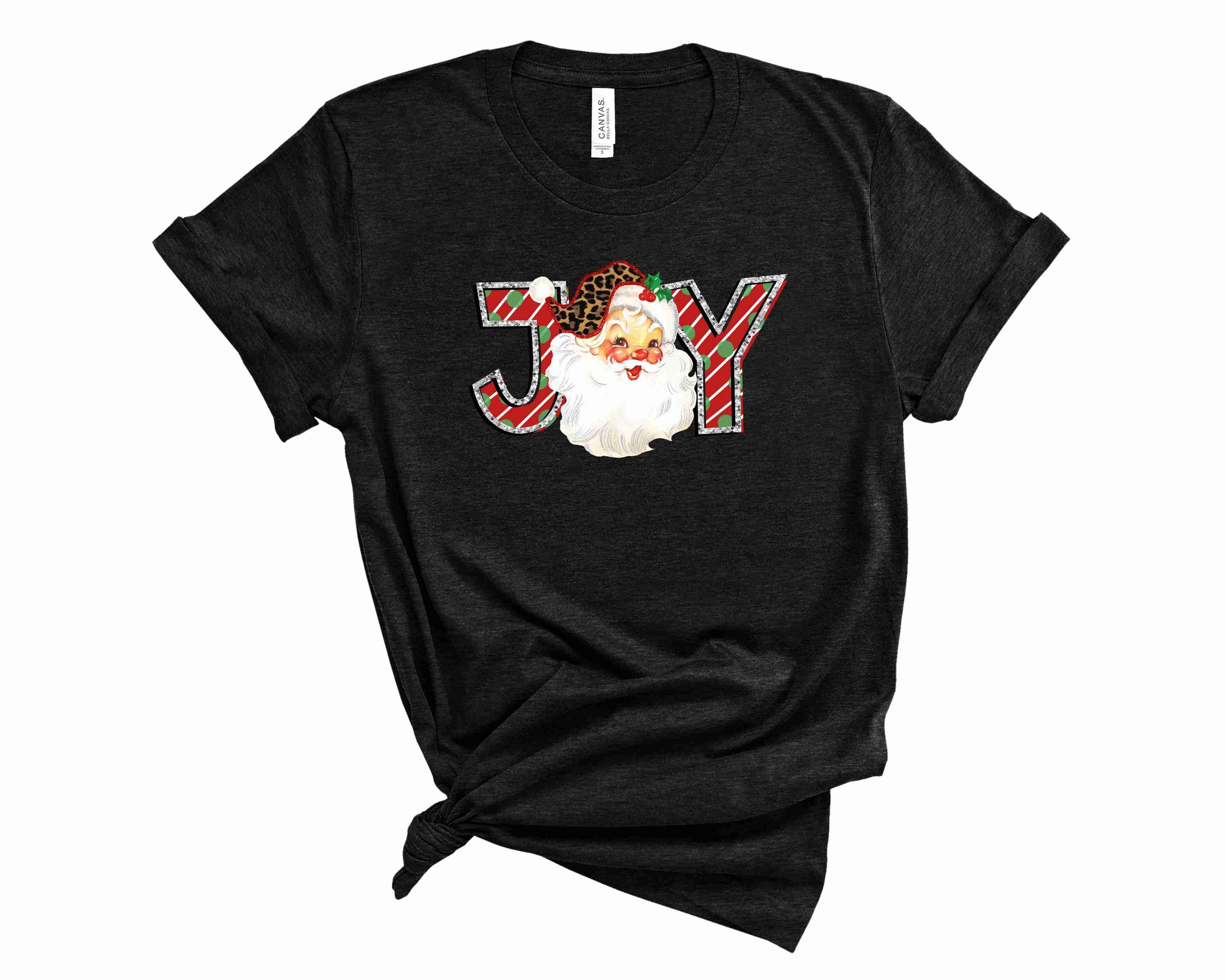 Joy Santa Graphic Tee featuring a colorful festive design, perfect for holiday celebrations.