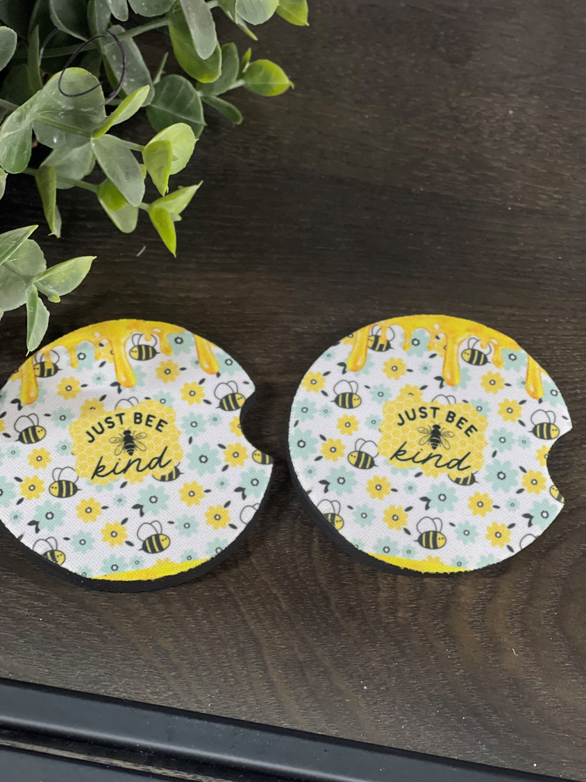 Just Bee Kind car coaster set featuring a vibrant design, made of durable neoprene, perfect for cup holders.