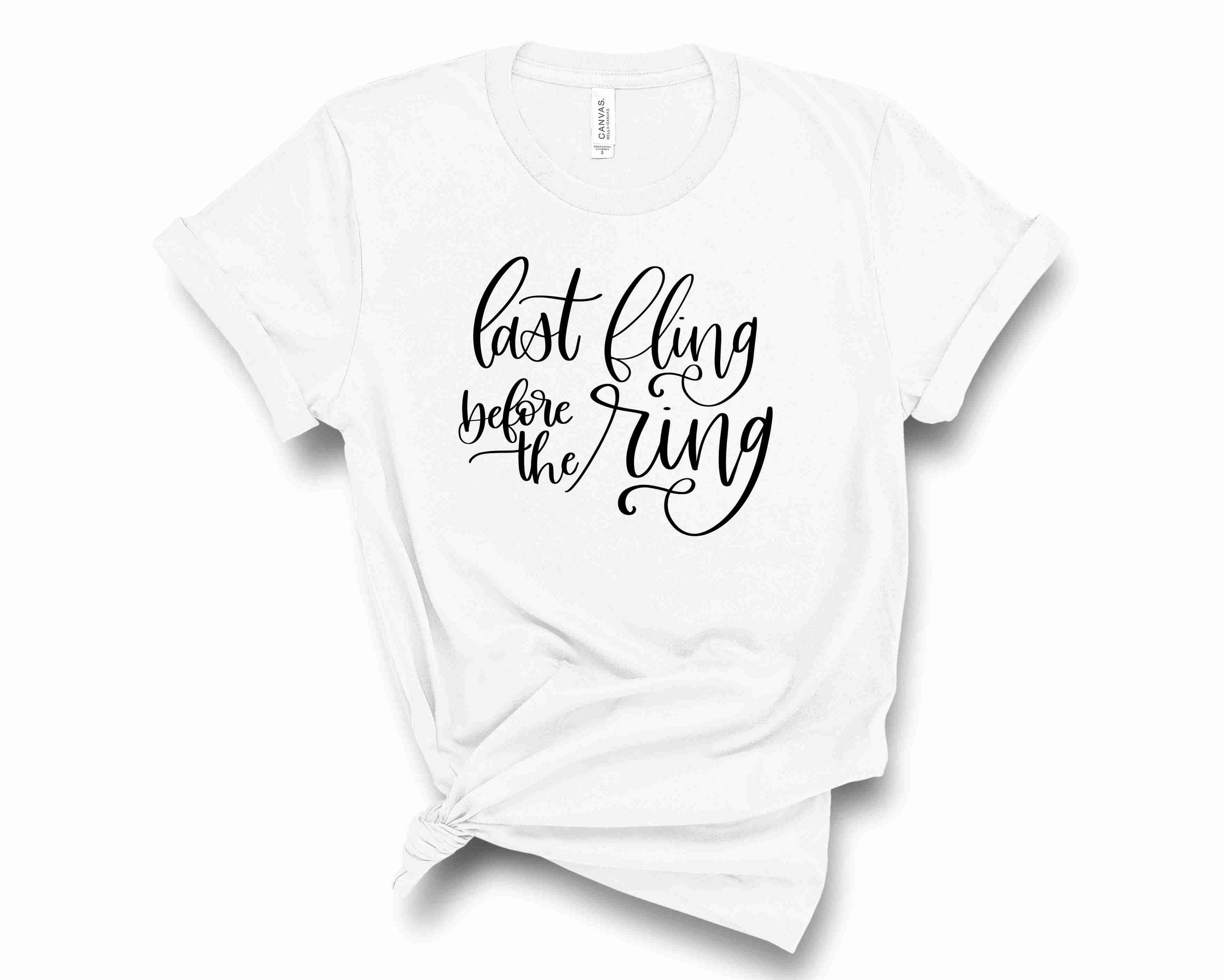 A stylish unisex graphic tee featuring the phrase 'Last Fling Before the Ring' in bold lettering, perfect for pre-wedding celebrations.