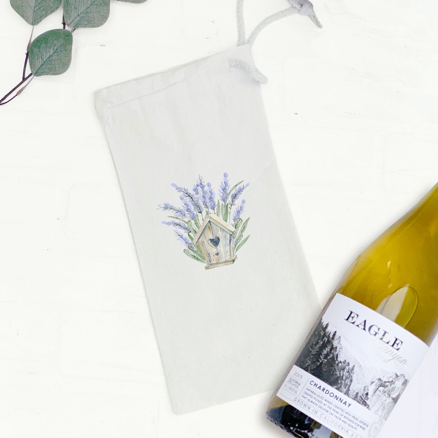 Lavender Birdhouse Canvas Wine Bag with drawstring closure, designed for 750mL bottles.
