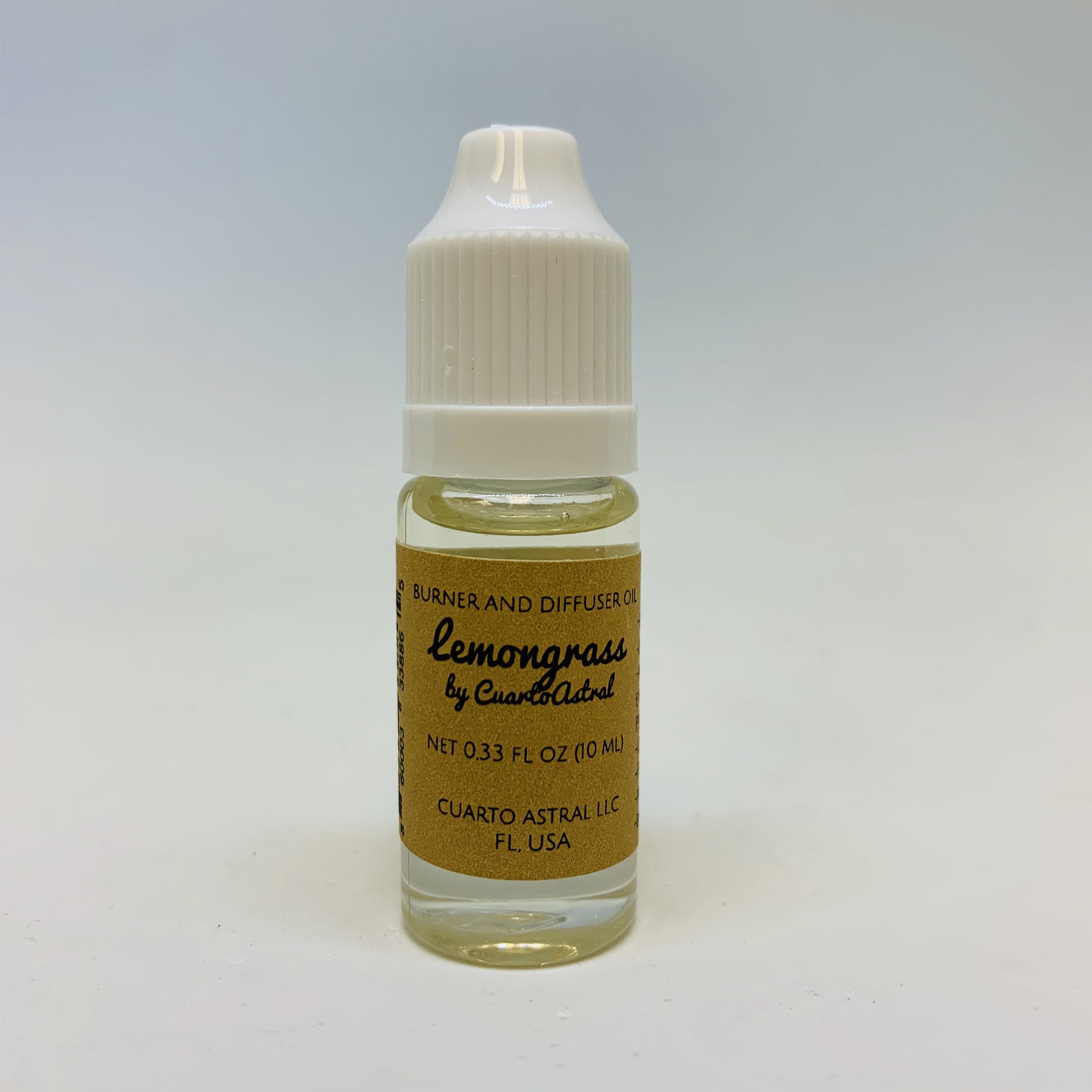 A 10ml bottle of CuartoAstral Lemongrass essential oil, showcasing its vibrant green label and sleek design, perfect for aromatherapy.