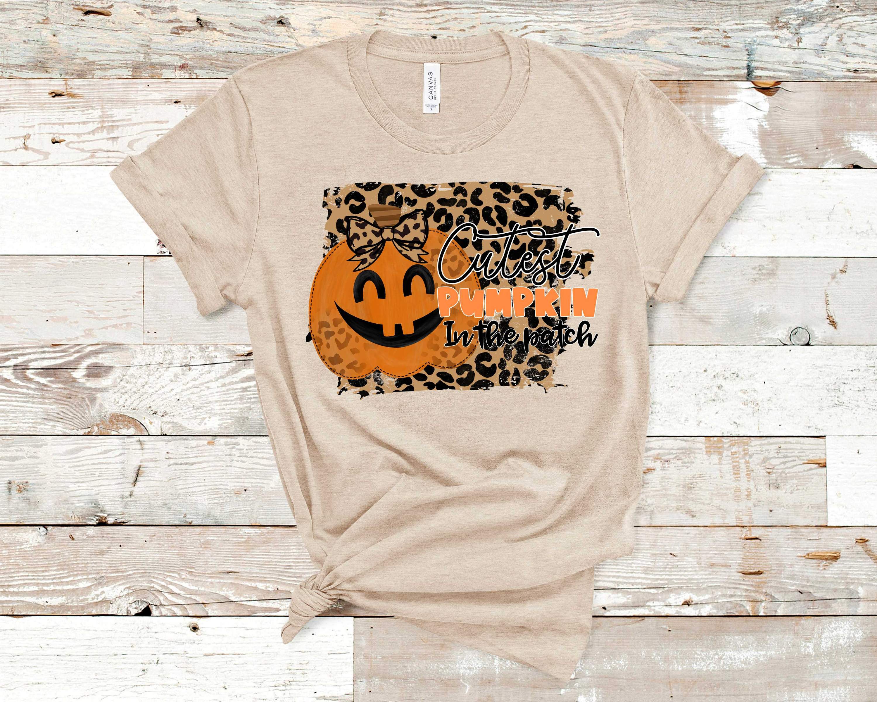 Leopard Cutest Pumpkin Graphic Tee featuring a stylish pumpkin design on a soft fabric, perfect for fall fashion.
