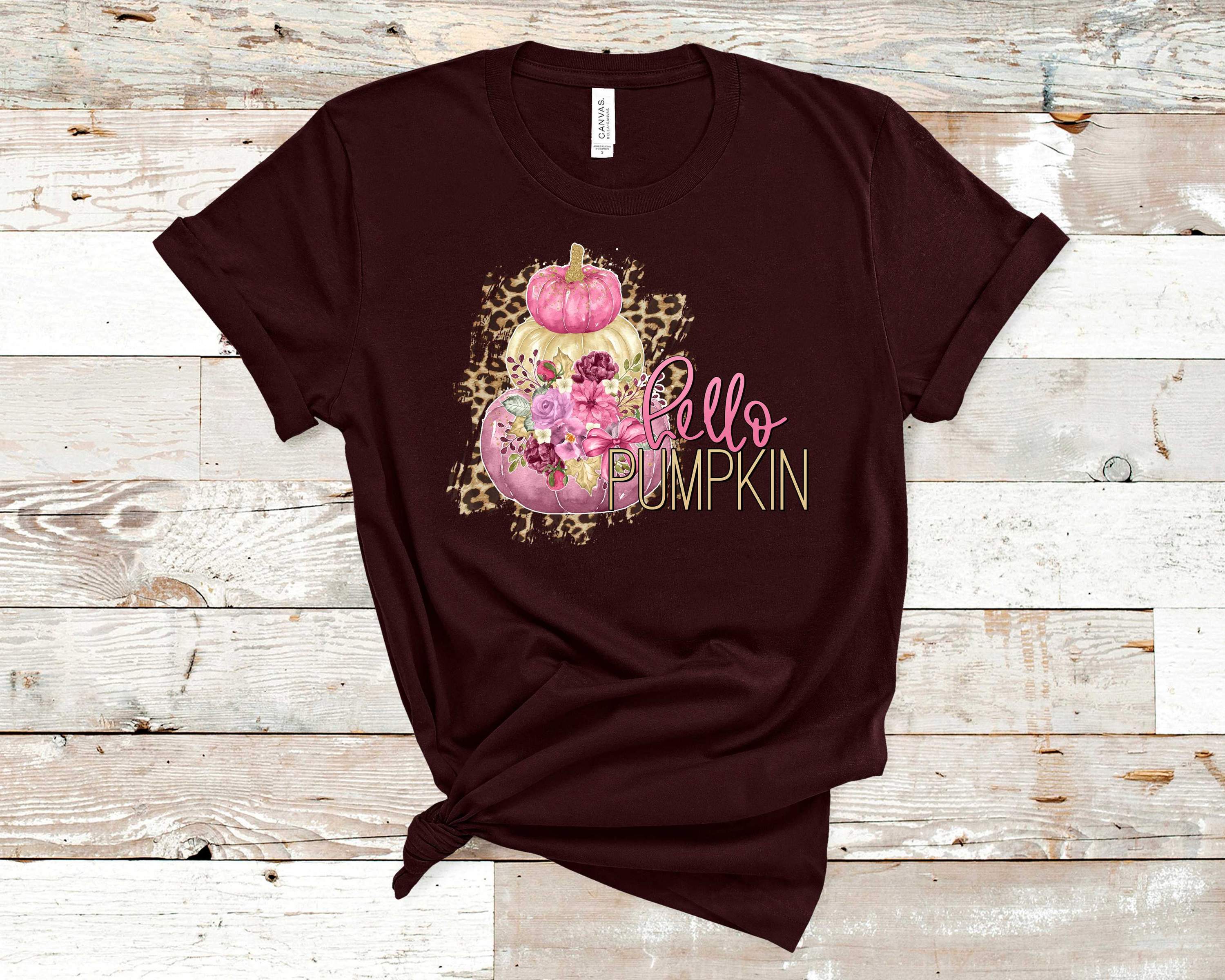 Leopard Hello Pumpkin Graphic Tee featuring a stylish leopard print and playful pumpkin design on a soft Bella Canvas t-shirt.