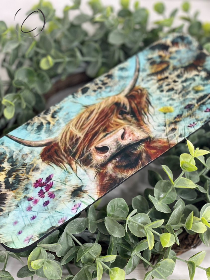 Leopard Highland Cow Slap Wrap Can Cooler featuring a stylish leopard print design, made of durable neoprene material.