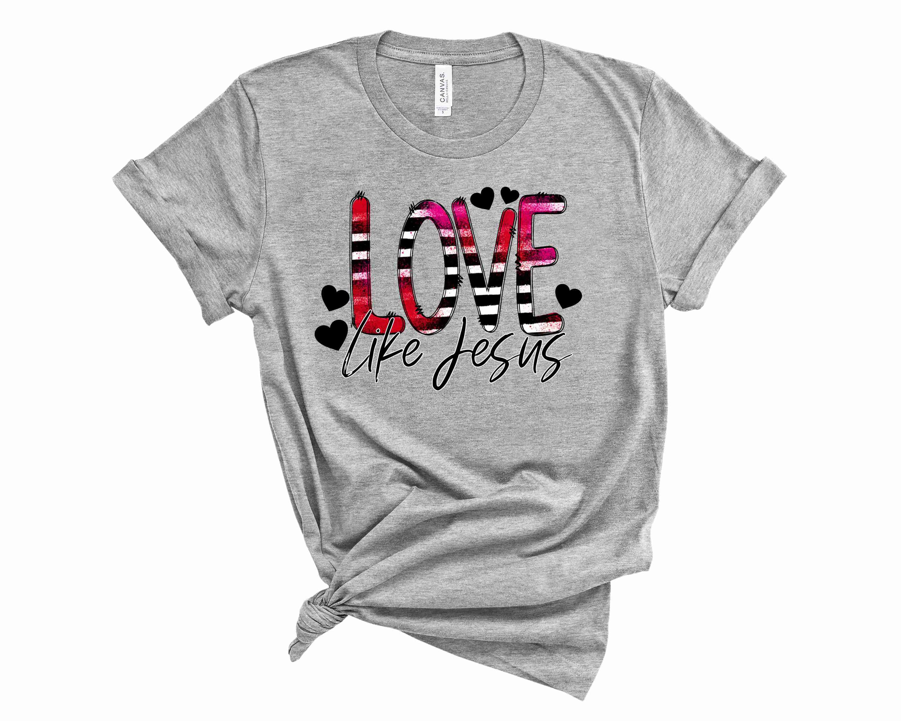 A unisex graphic tee featuring the phrase 'Love Like Jesus' in a stylish font, perfect for casual wear.