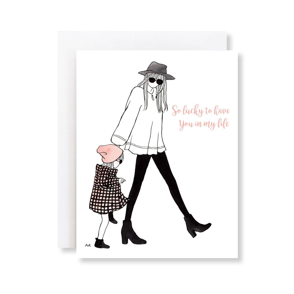 A beautifully illustrated card featuring a mother and daughter, showcasing the text 'Lucky To Have You', with a crystal metallic envelope.