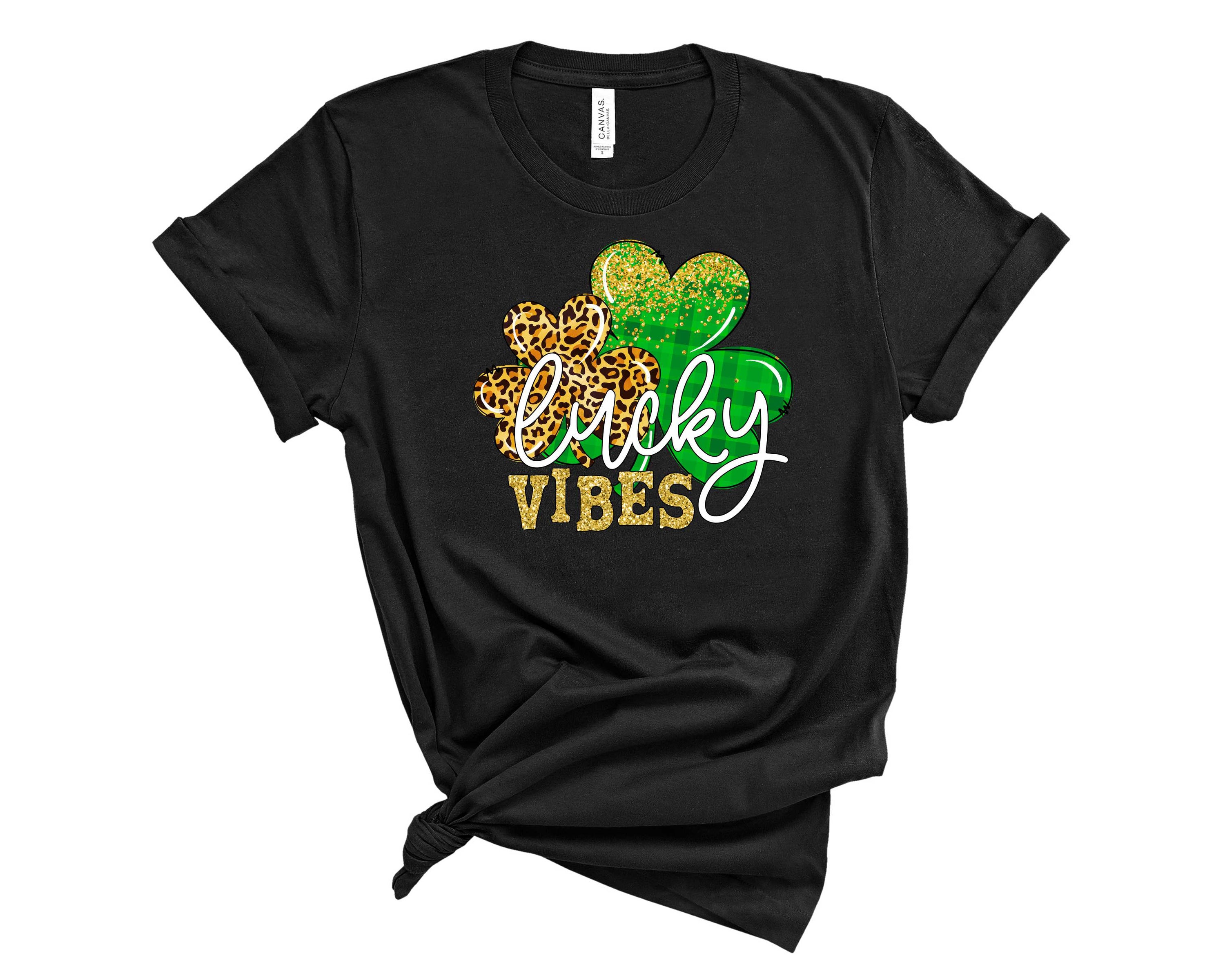 A unisex graphic tee featuring a vibrant clover design symbolizing luck and positivity, perfect for casual wear.