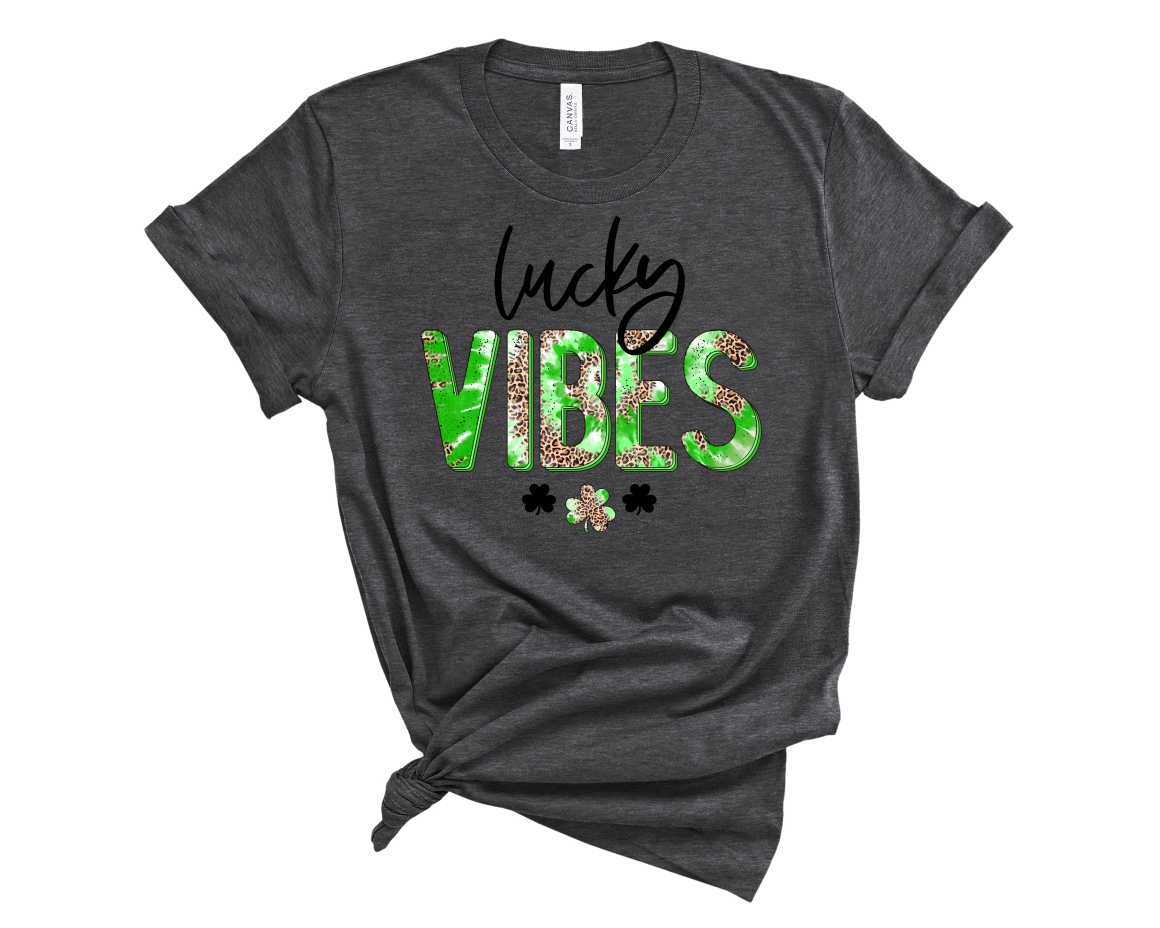 Lucky Vibes Leopard Tie Dye Graphic Tee featuring a unique leopard print design in vibrant colors on a soft fabric.