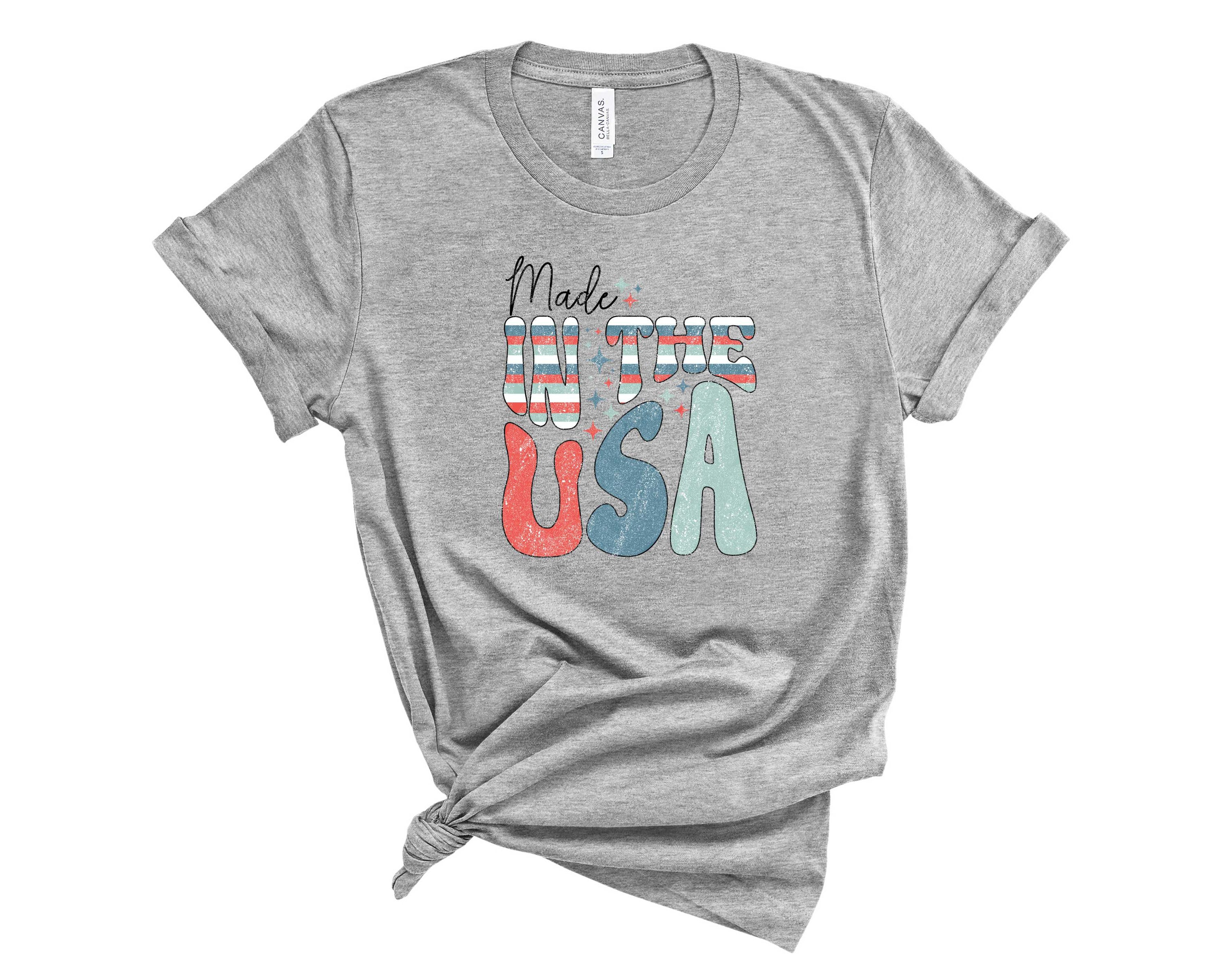 A unisex graphic tee featuring a unique wonky design, made in the USA, showcasing vibrant colors and a comfortable fit.