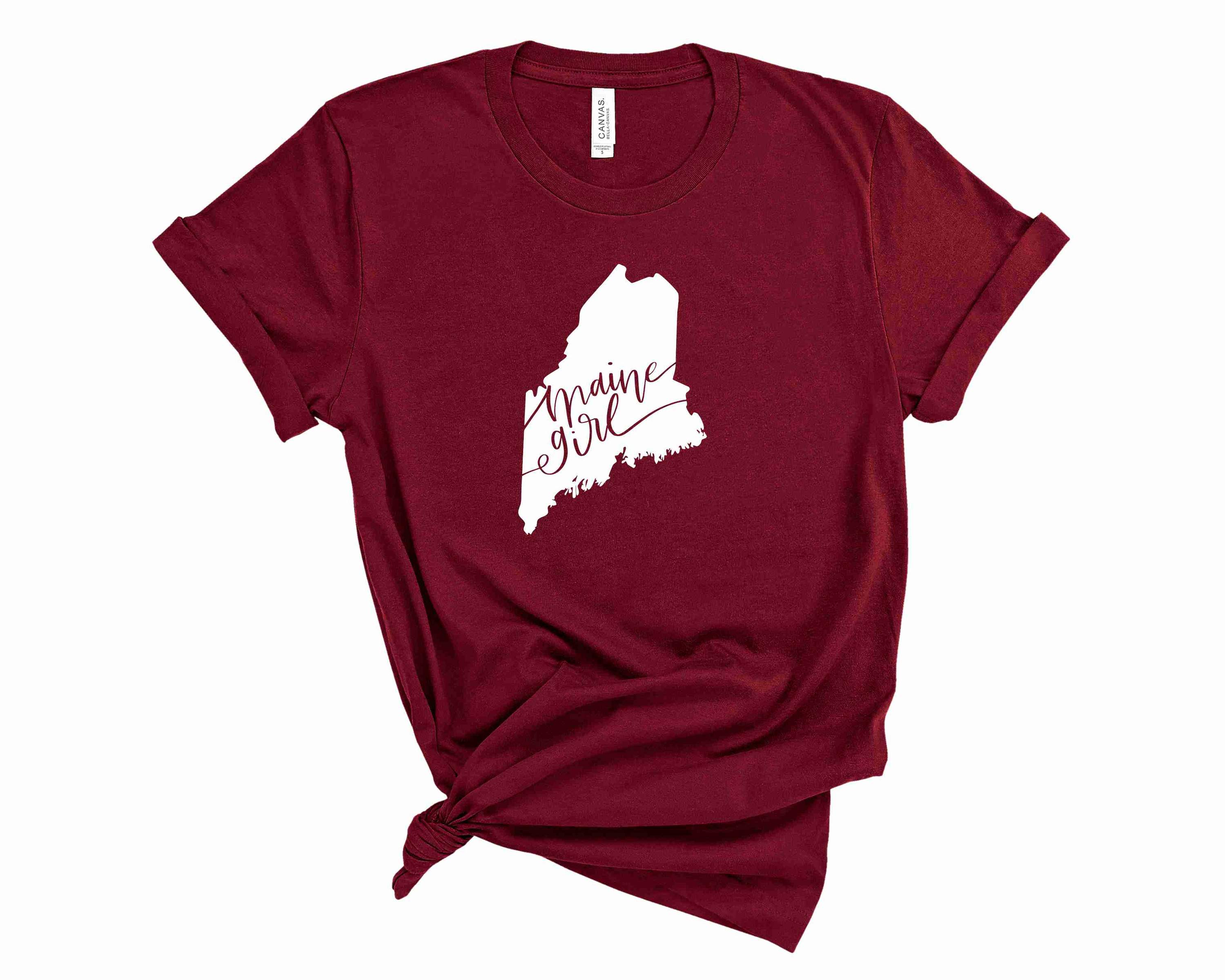 Maine Girl Graphic Tee featuring a trendy design on a soft unisex t-shirt.