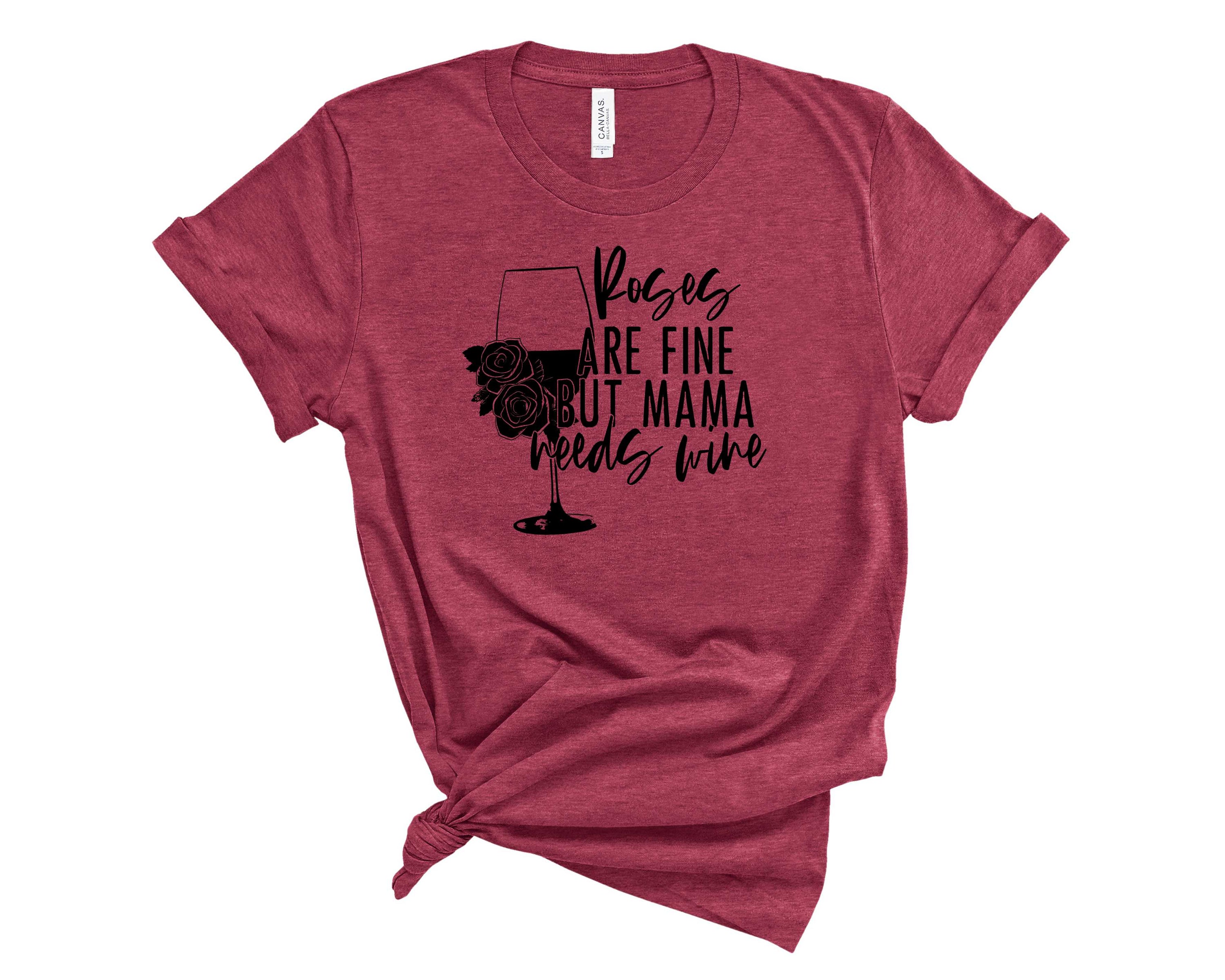 Mama Needs Wine Graphic Tee featuring a playful wine-themed design on a soft fabric.