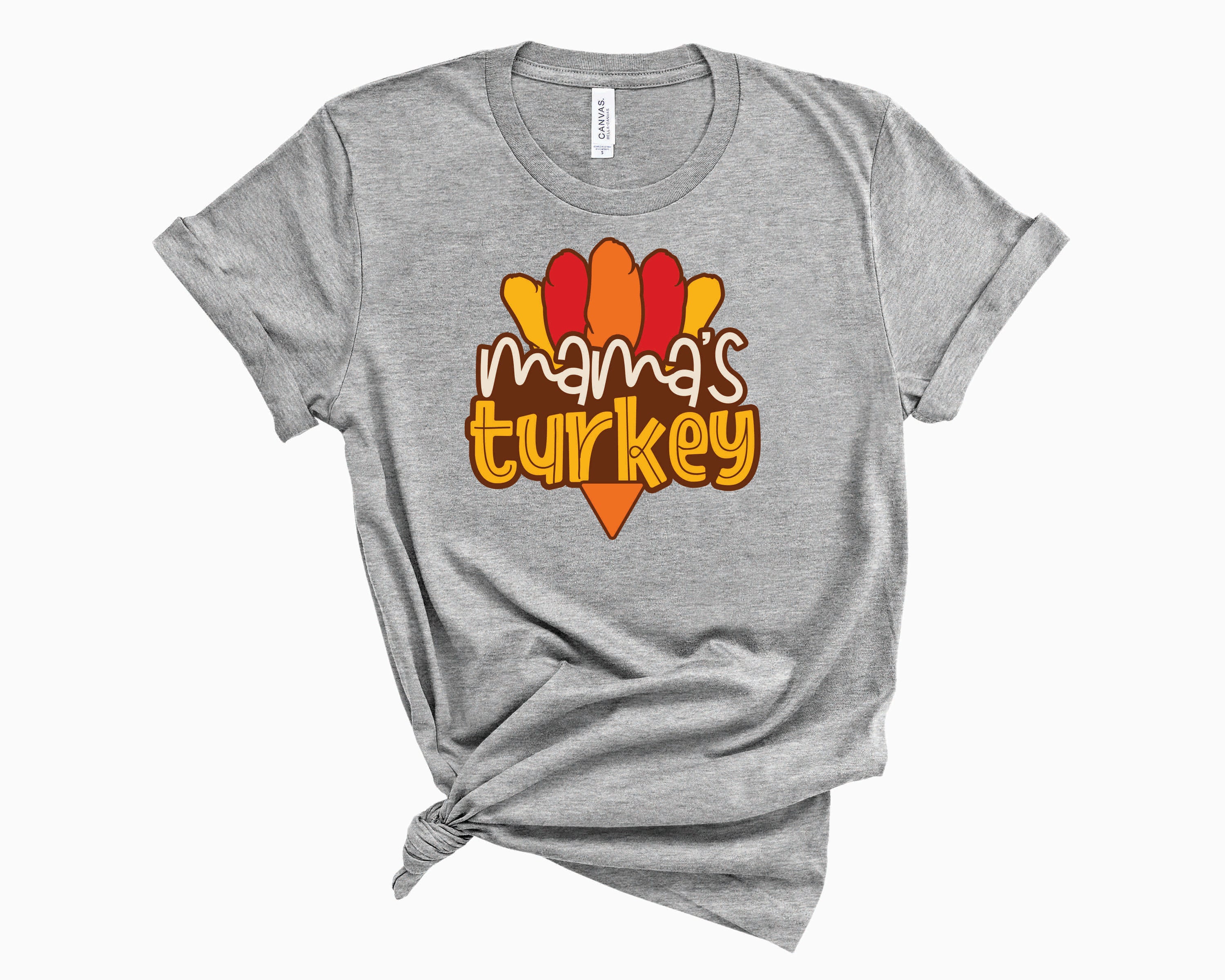 Mama's Turkey Graphic Tee featuring a vibrant turkey design on a soft unisex t-shirt.