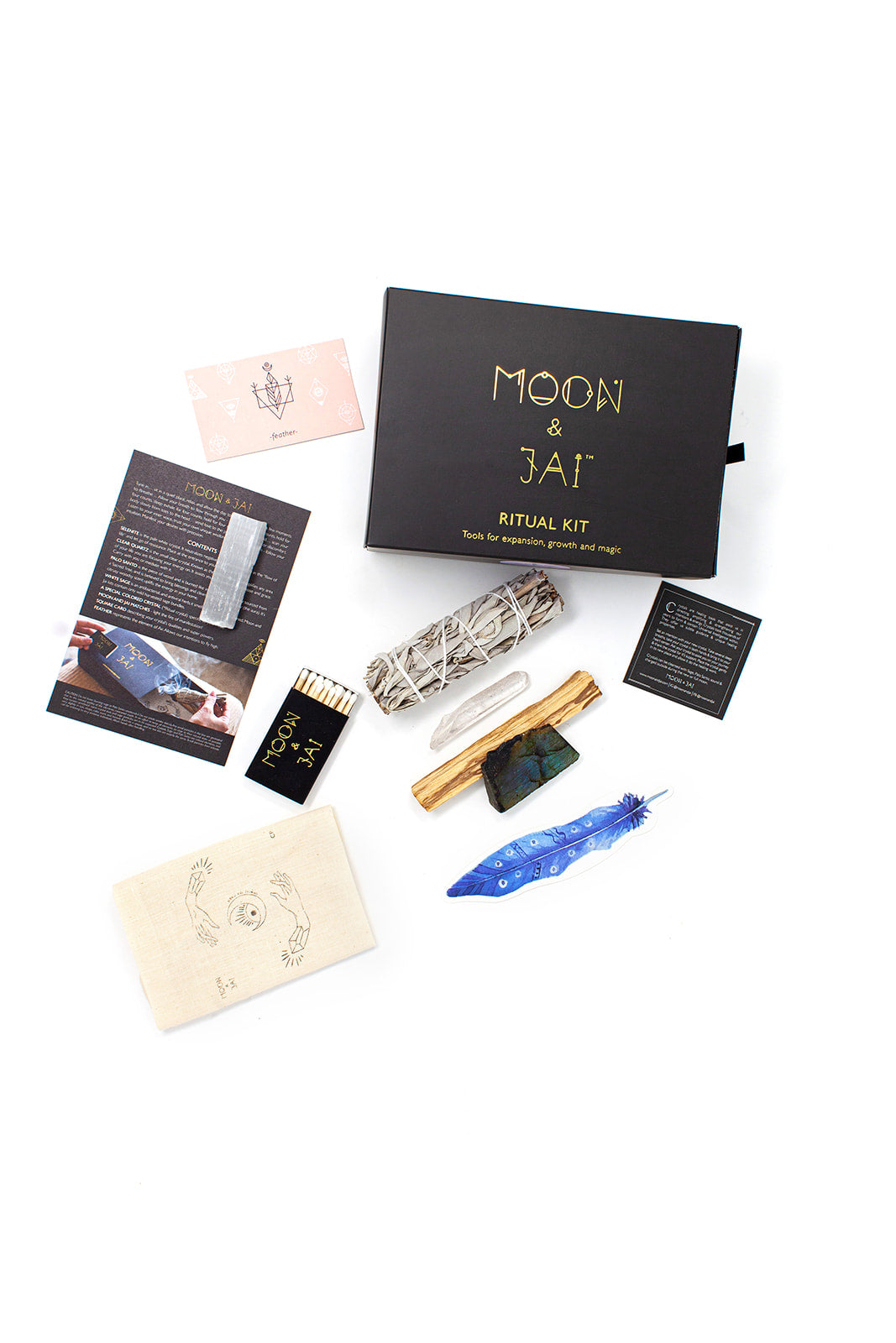 Manifest Ritual Kit featuring Labradorite, Clear Quartz, Sage, and Palo Santo in an elegant black box.