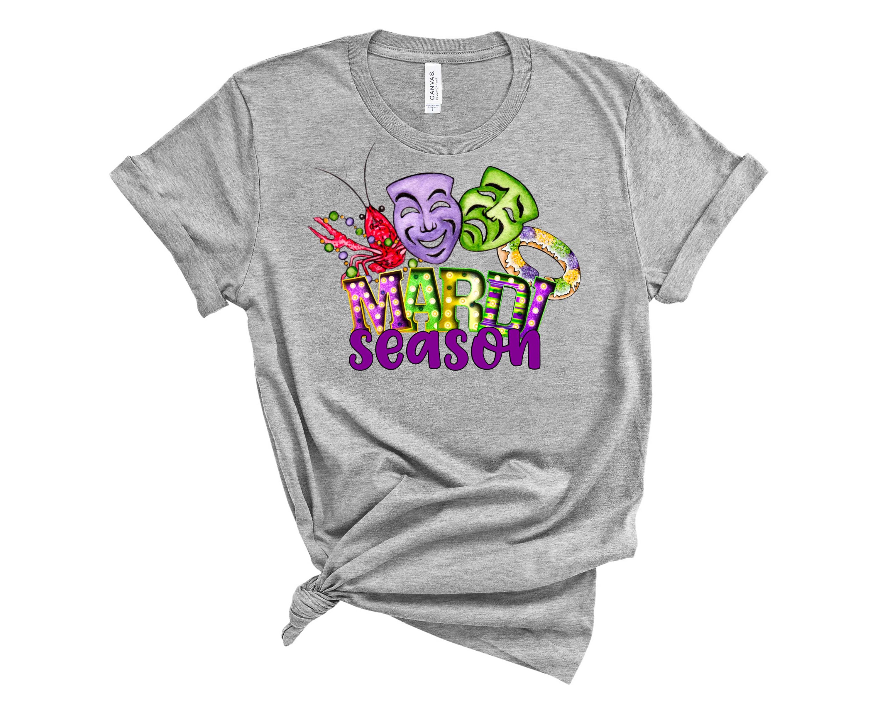 Mardi Season Graphic Tee featuring vibrant Mardi Gras designs in a unisex fit, perfect for festive celebrations.