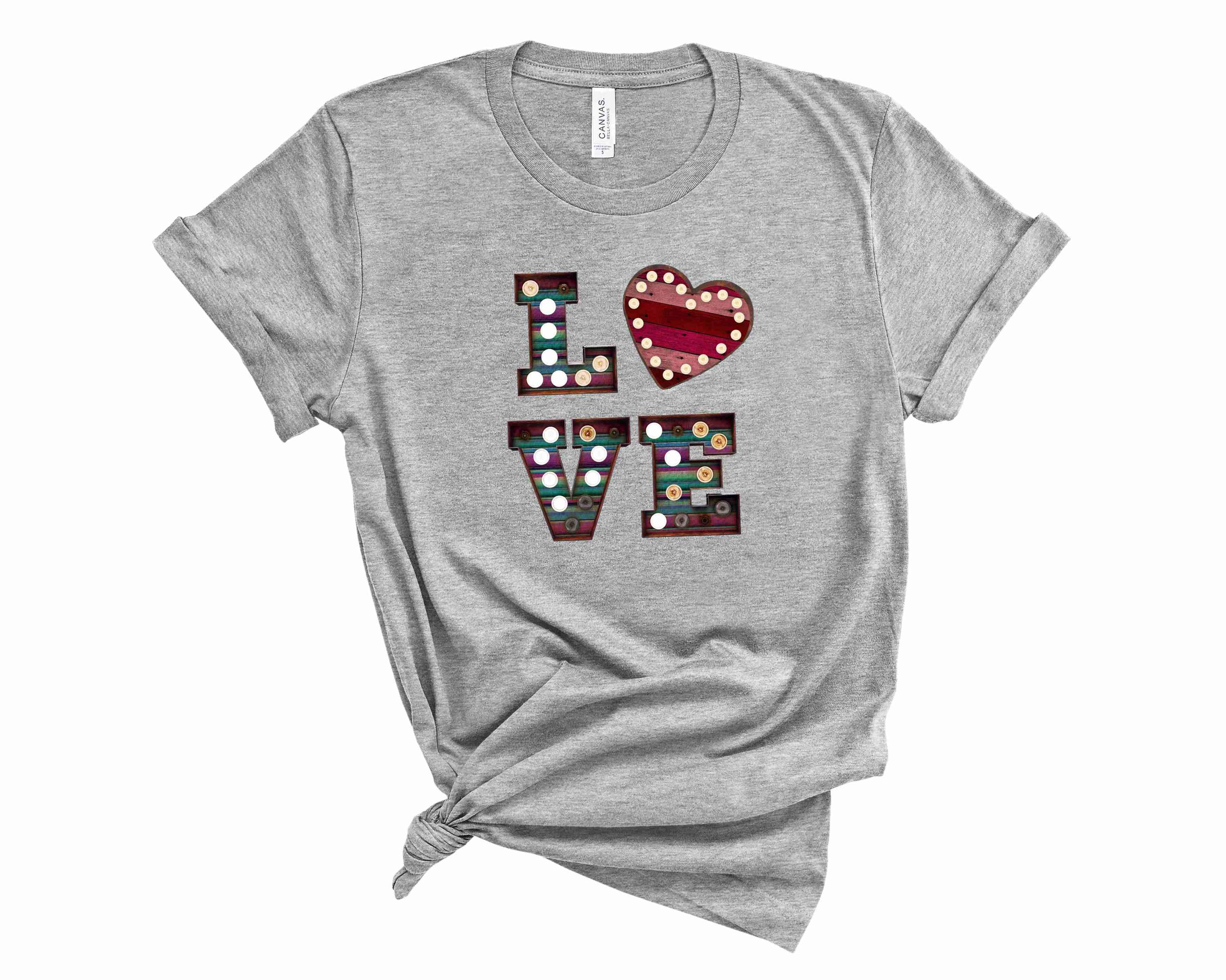Marquee Love Graphic Tee displayed on a mannequin, featuring a trendy graphic design in a soft fabric, suitable for both men and women.
