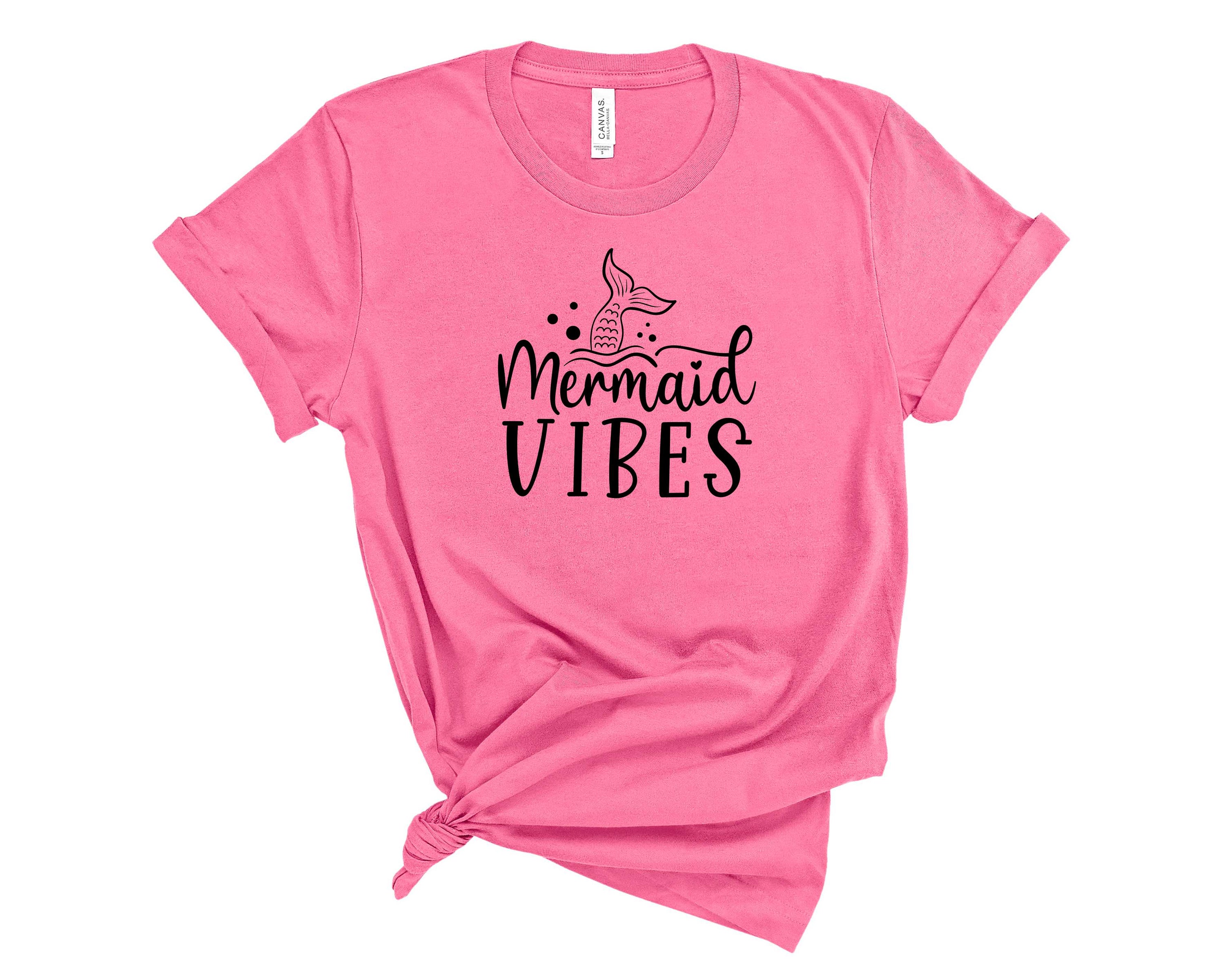 A stylish unisex graphic tee featuring a vibrant mermaid design, perfect for casual wear and beach outings.