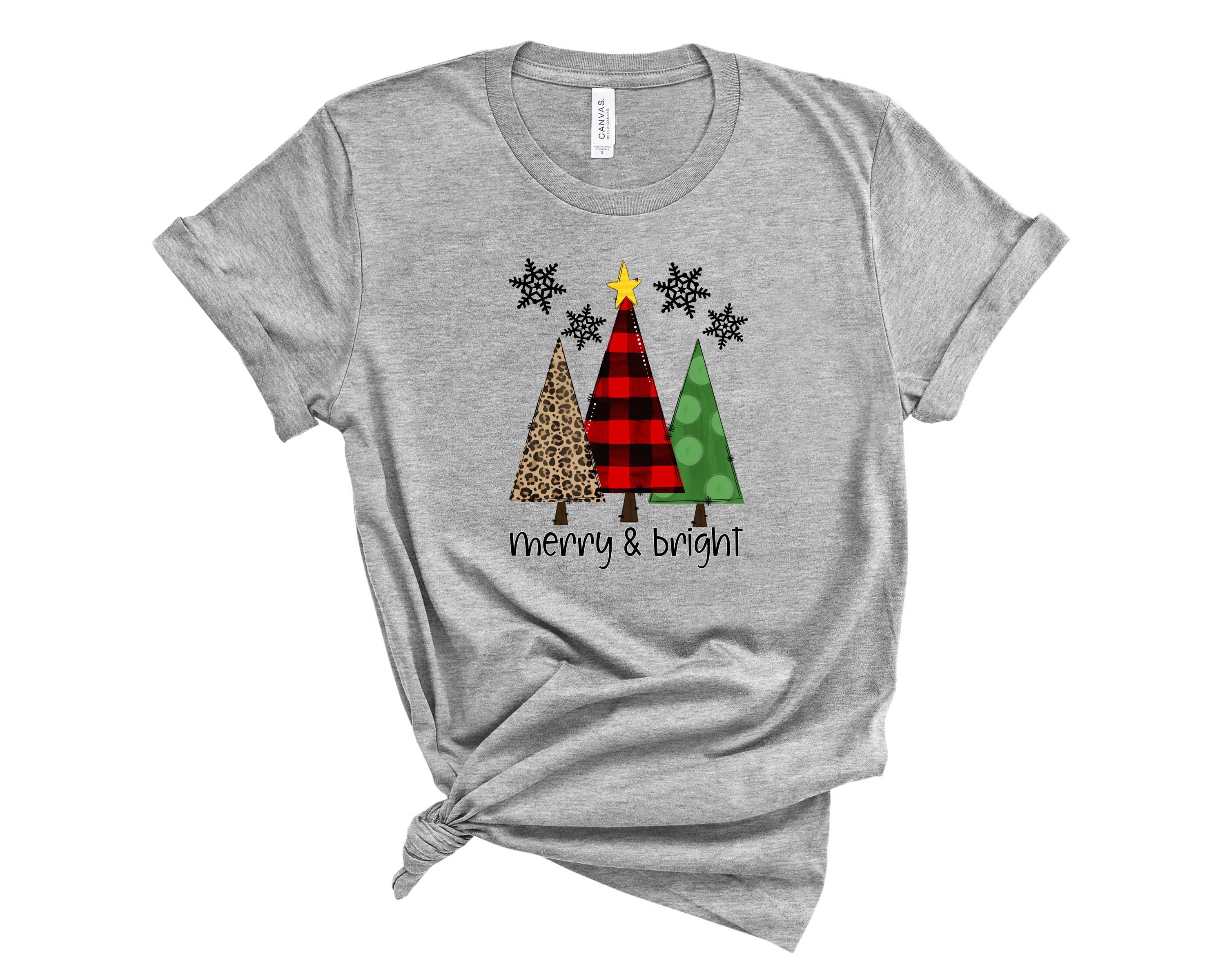 Merry and Bright Trees Graphic Tee featuring a festive tree design on a unisex t-shirt.