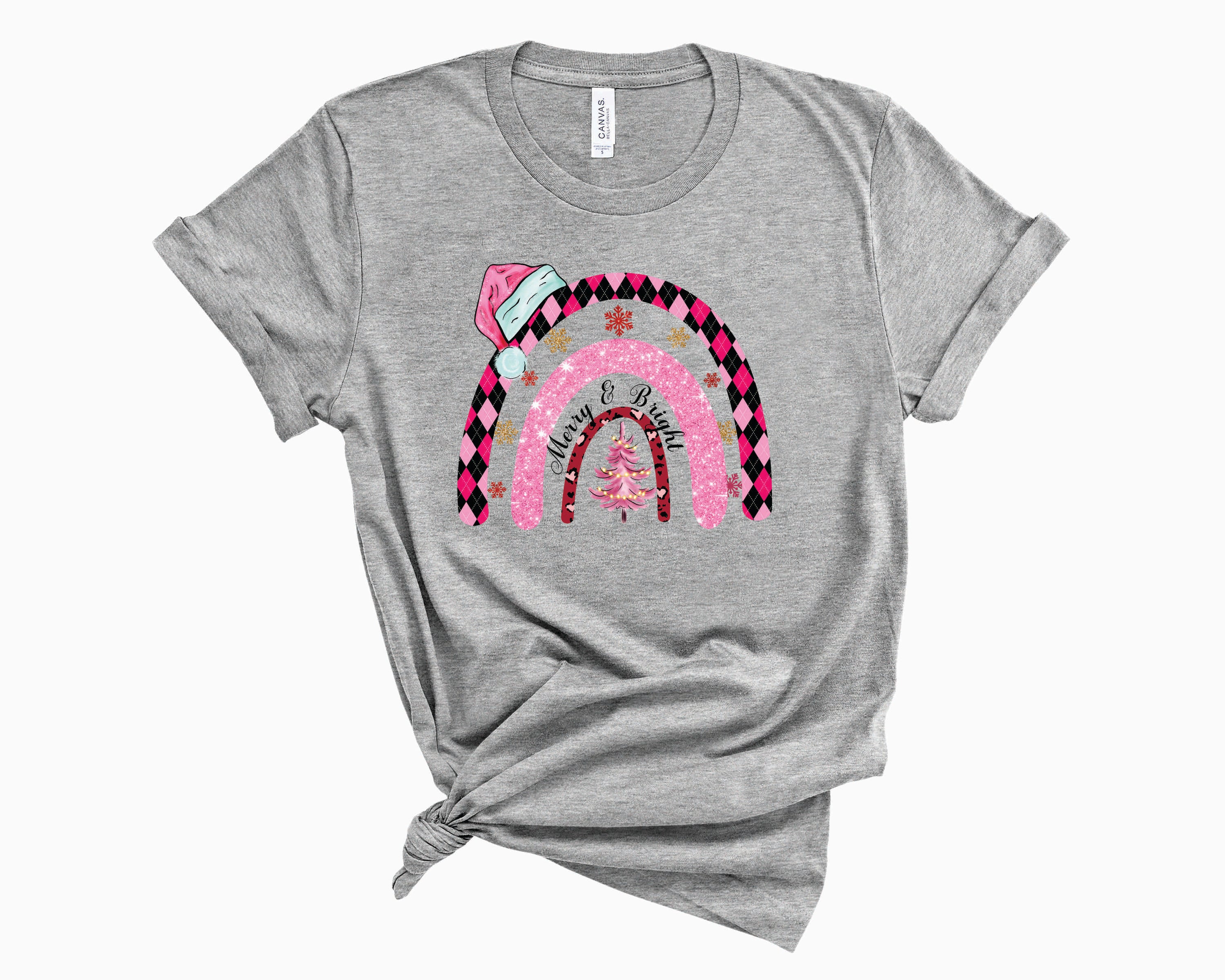Merry & Bright Pink Hat Rainbow Graphic Tee featuring a vibrant pink hat and rainbow design on a soft fabric.