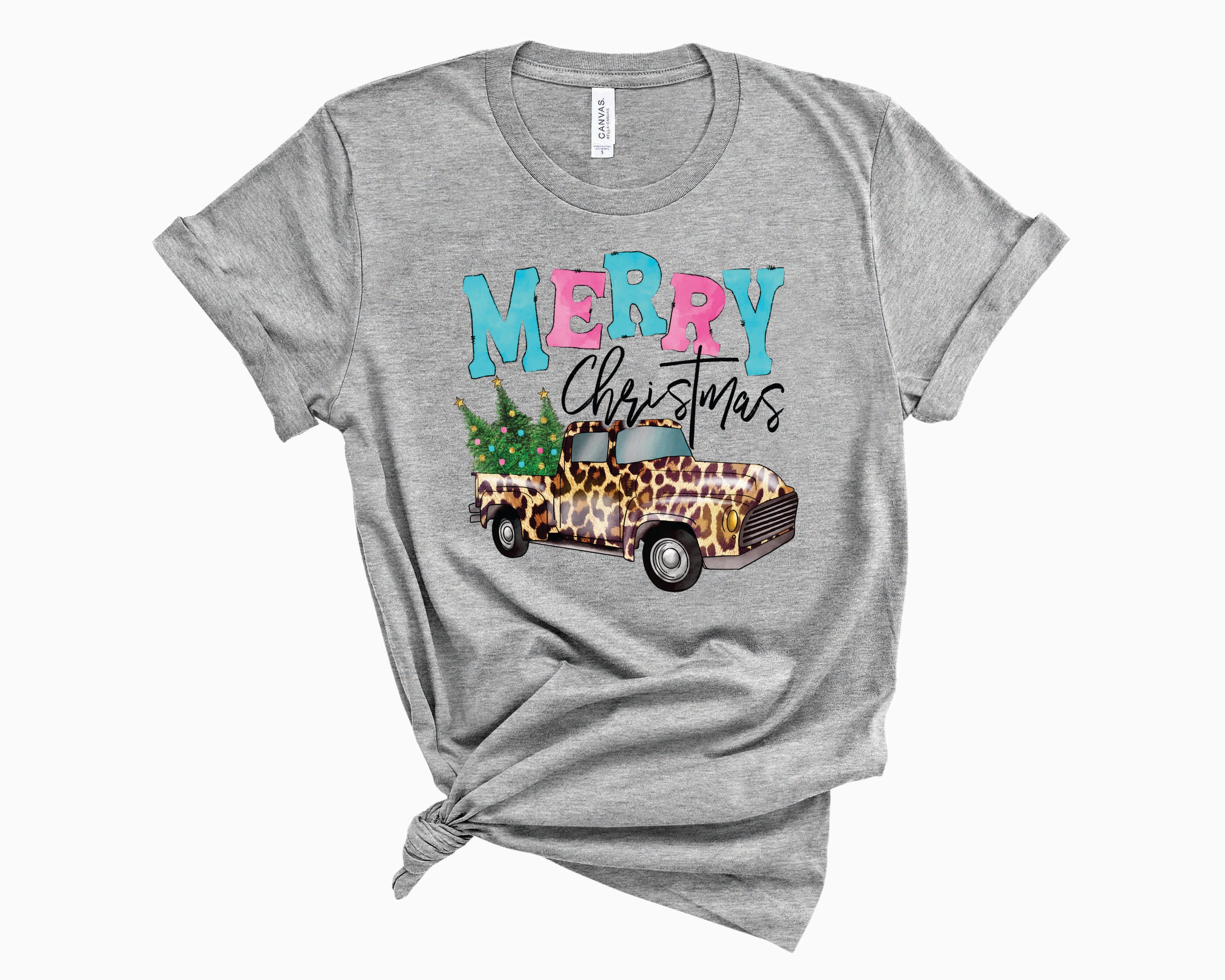 Merry Christmas Leopard Truck Graphic Tee featuring a stylish leopard print truck design on a comfortable unisex t-shirt.