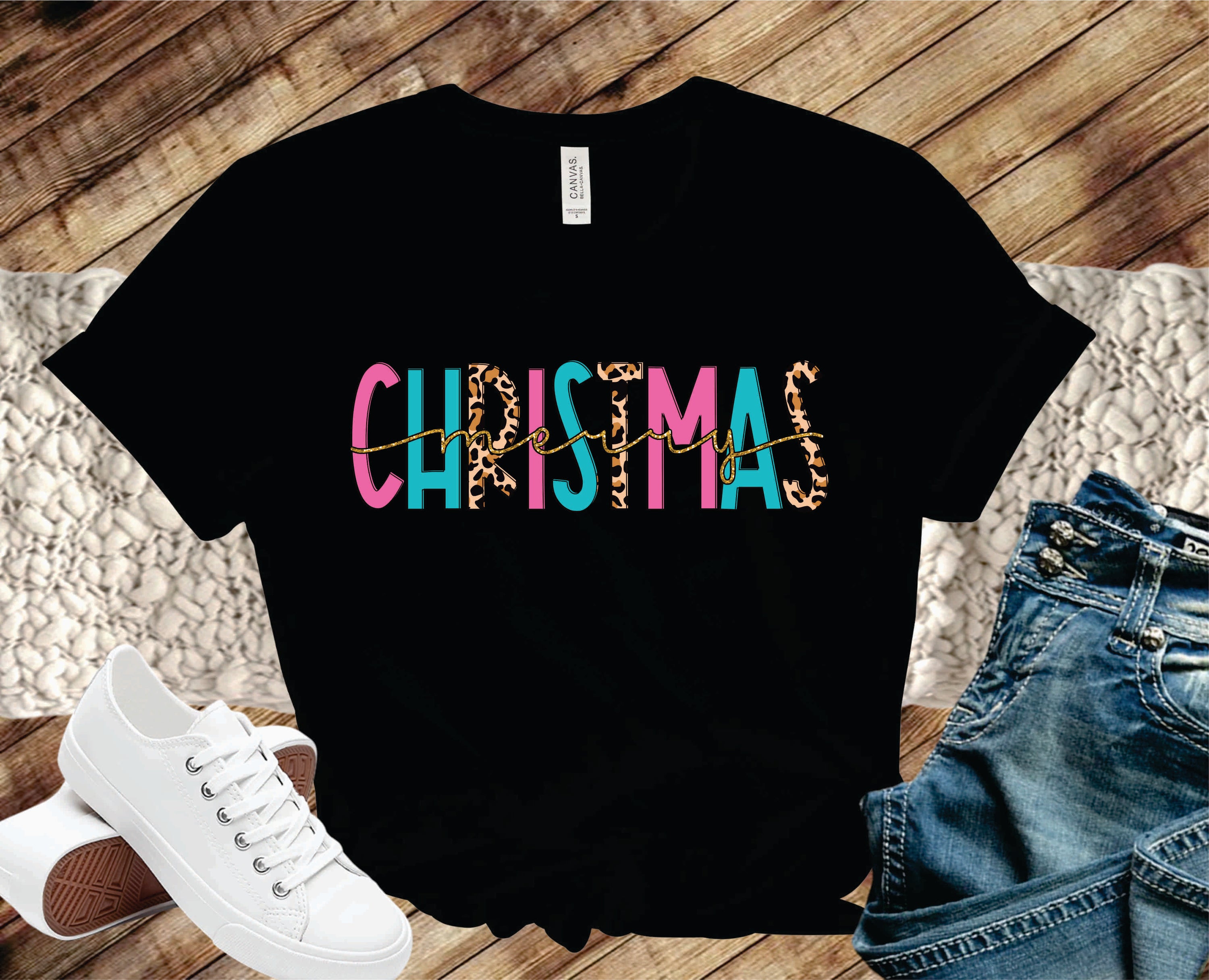 Merry Christmas Pink Blue Leopard Graphic Tee featuring vibrant colors and a trendy leopard print design.