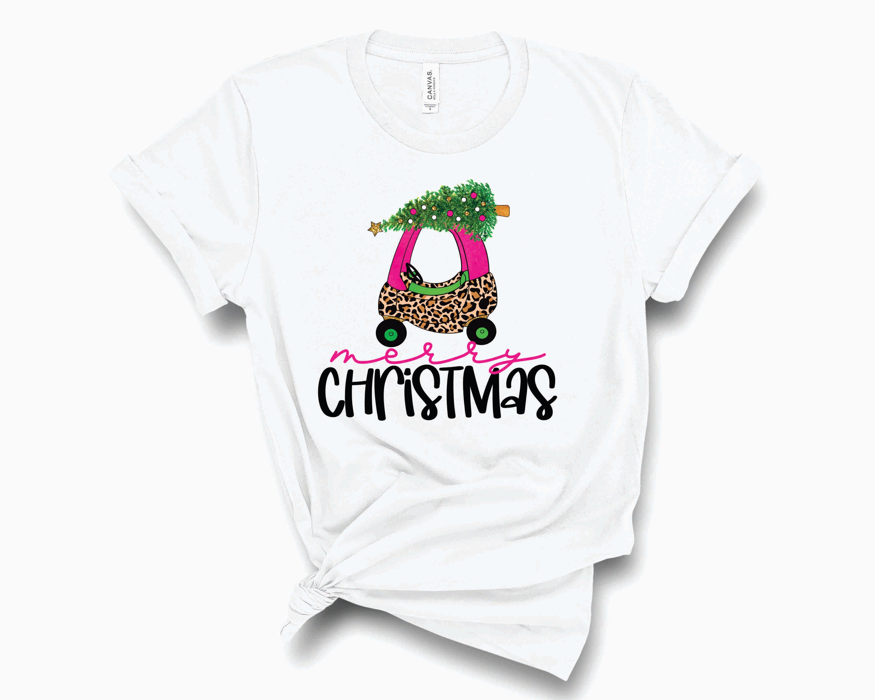 Merry Christmas Pink Leopard Coupe Graphic Tee featuring a festive design with pink leopard print, perfect for holiday celebrations.