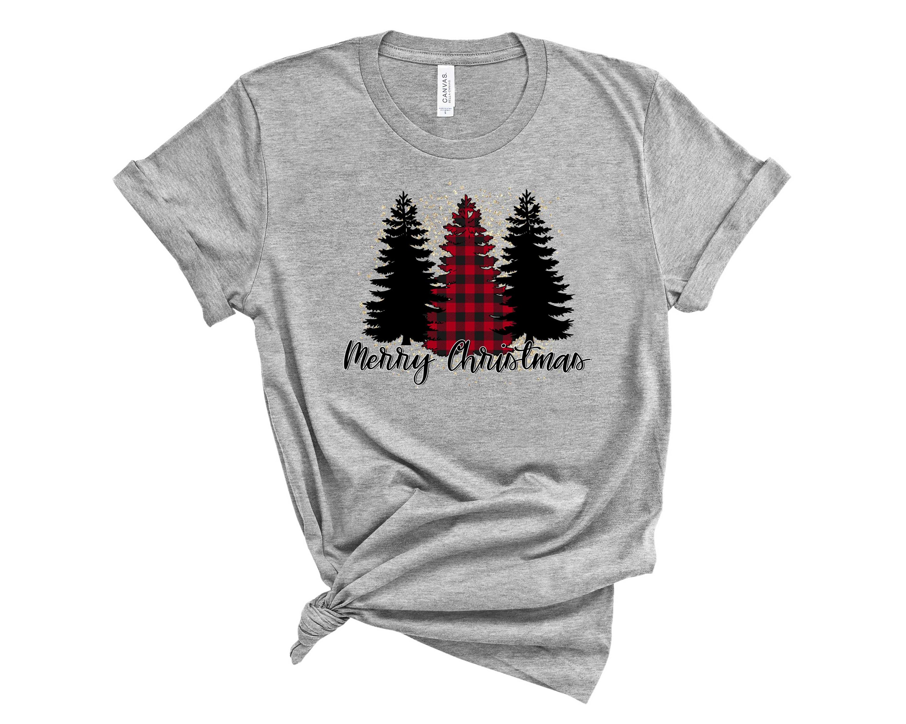 Merry Christmas Three Trees graphic tee featuring three decorated Christmas trees on a soft fabric.