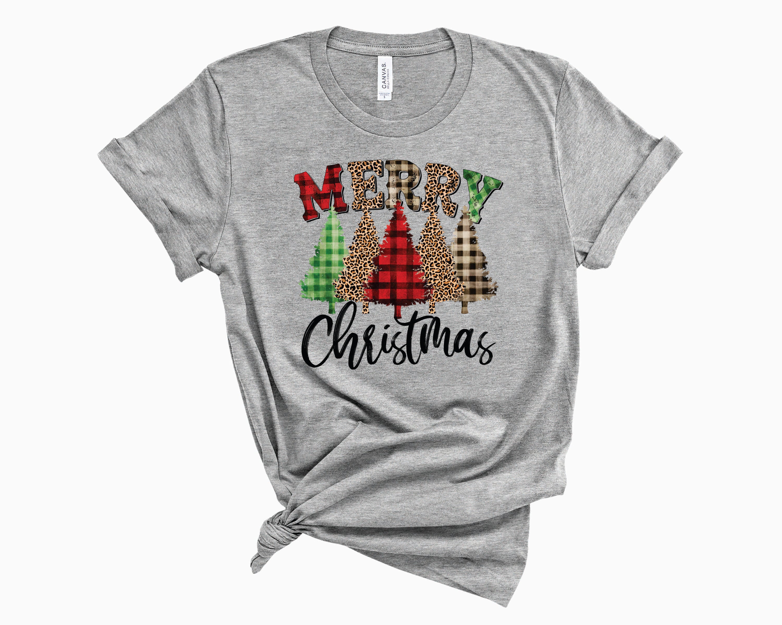 Merry Christmas Trees Mixed Plaid Graphic Tee featuring a festive design with Christmas trees and plaid patterns.