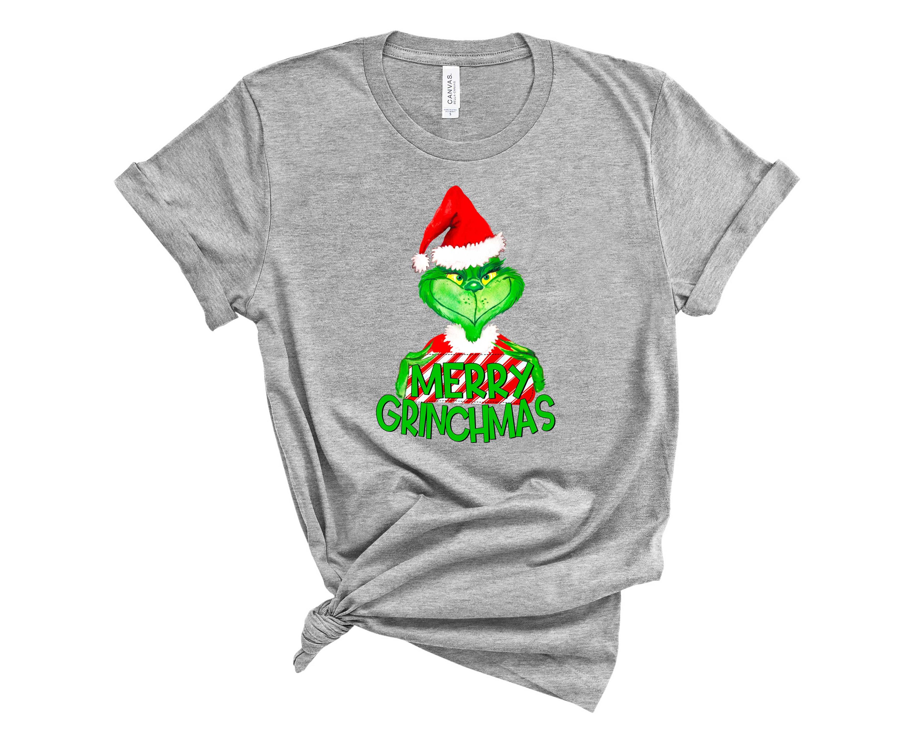 Merry G-mas Graphic Tee featuring a festive design, suitable for all genders, made from soft fabric.
