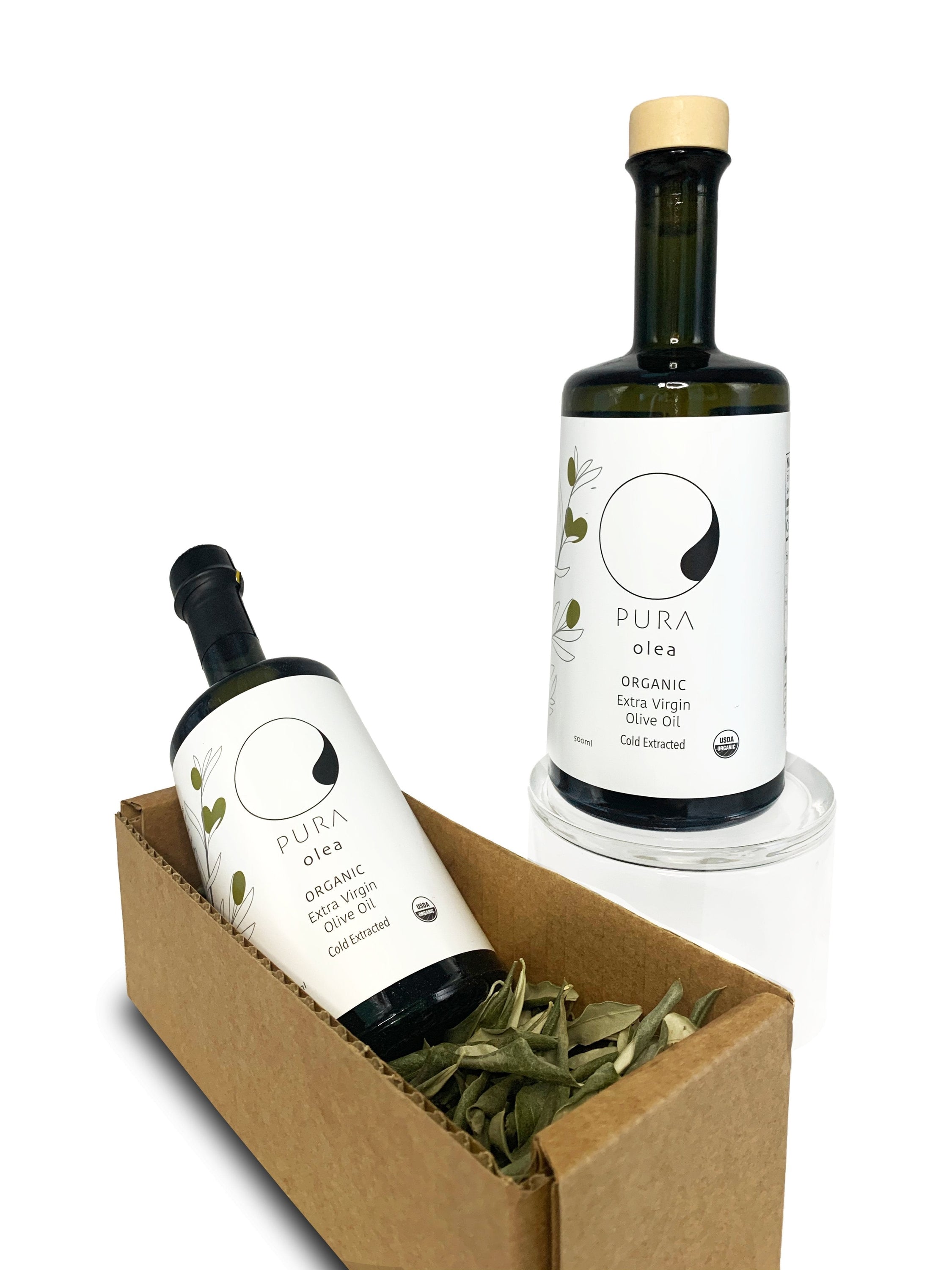 A case pack of 12 bottles of organic extra virgin olive oil, showcasing the elegant design and rich color of the oil inside.