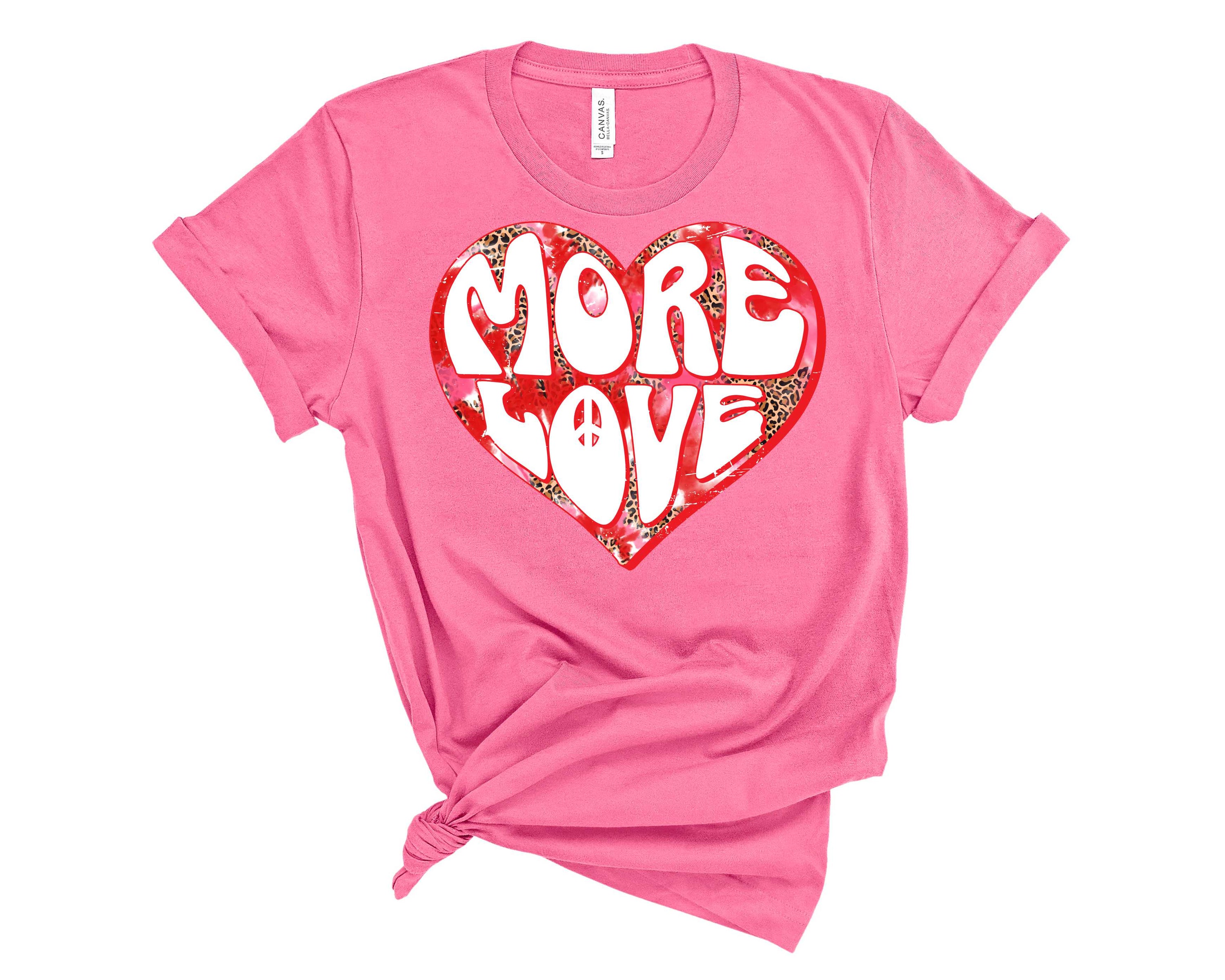 More Love Leopard Heart Graphic Tee featuring a stylish leopard heart design on a soft unisex t-shirt.