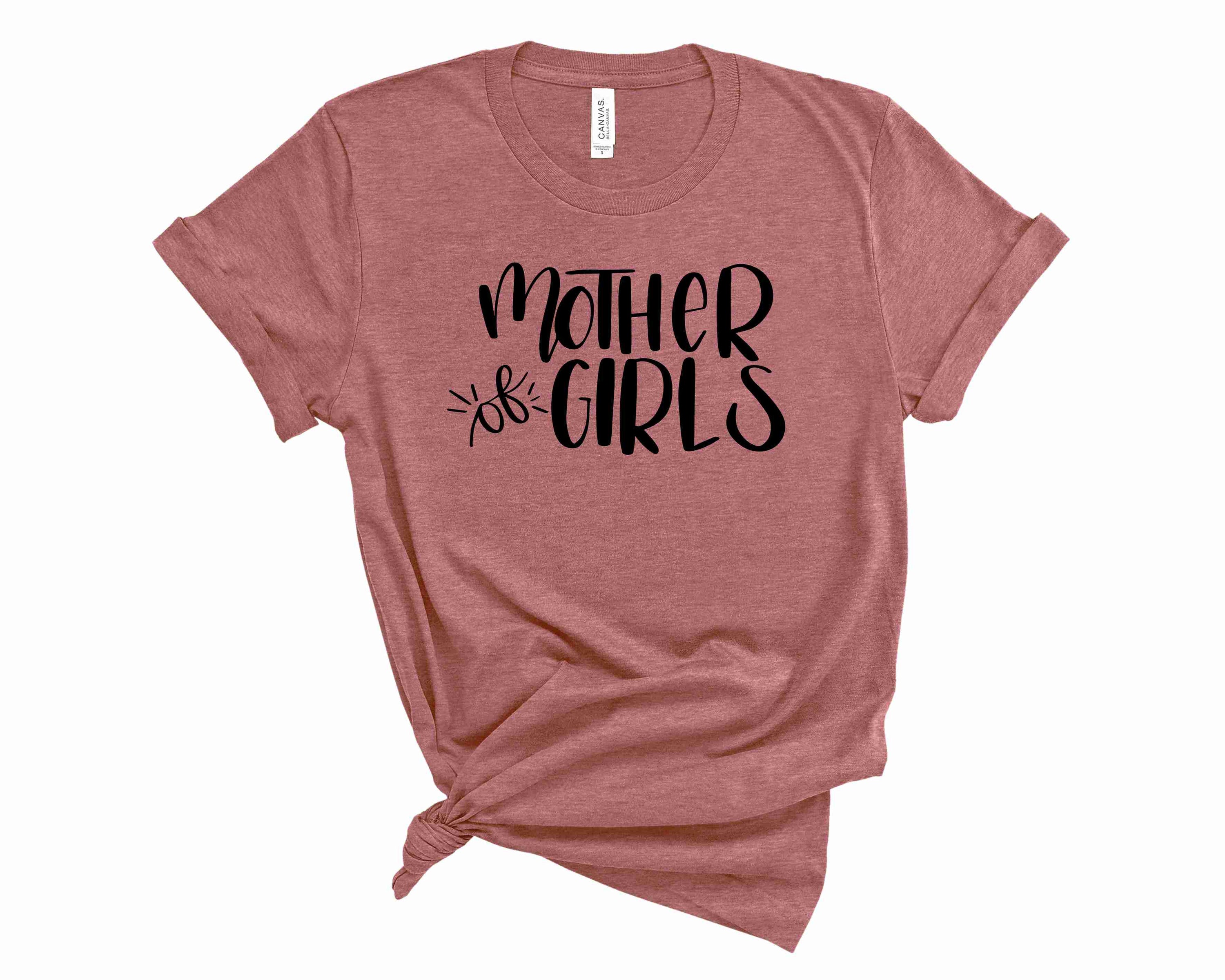 A stylish unisex graphic tee featuring the phrase 'Mother Of Girls' in bold letters, perfect for casual wear.