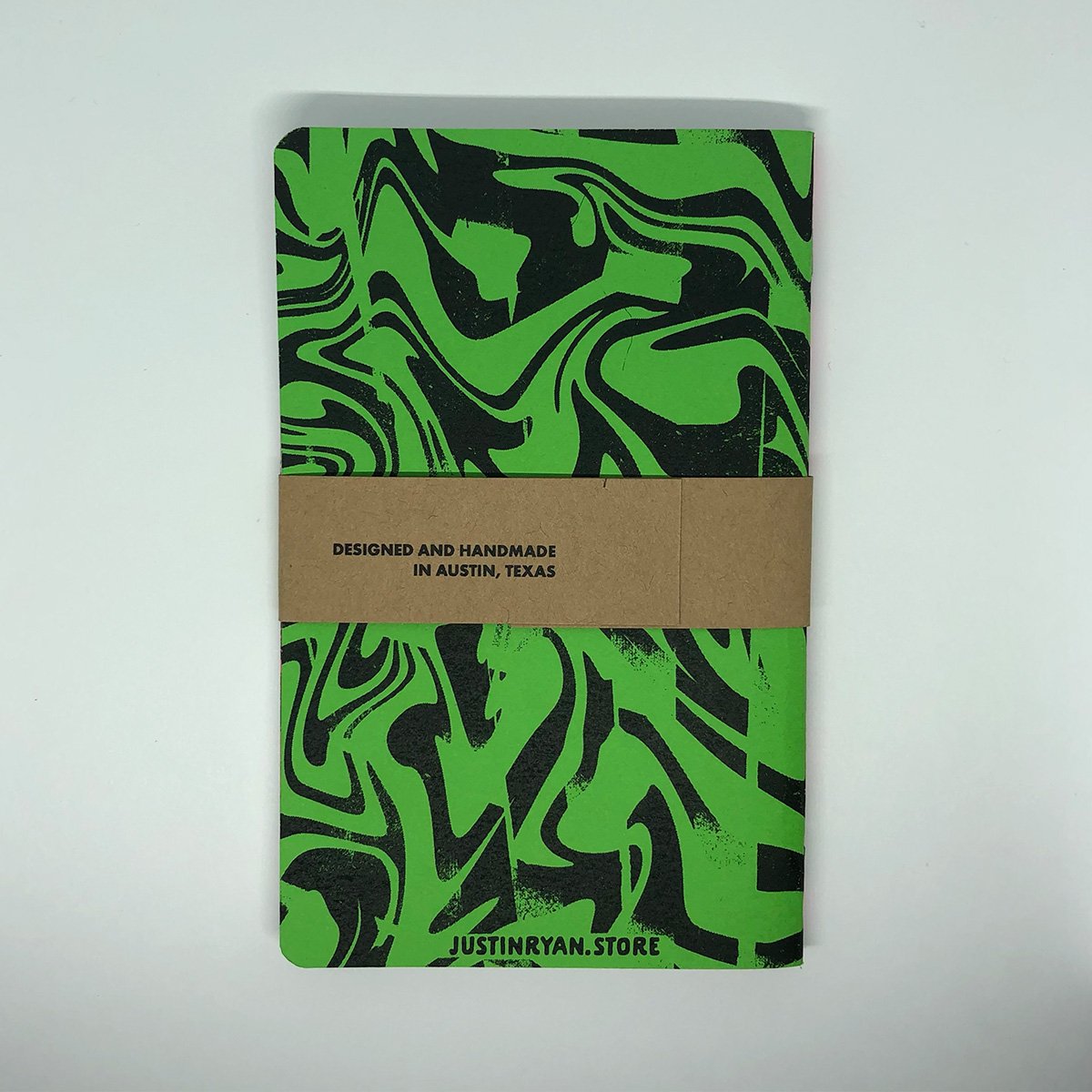 Two Neon Marble grid memo books featuring unique marble patterns on colorful covers, showcasing their compact size and high-quality design.