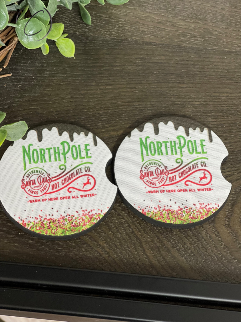 North Pole Hot Chocolate neoprene car coasters featuring a festive design, perfect for holding hot beverages in car cup holders.
