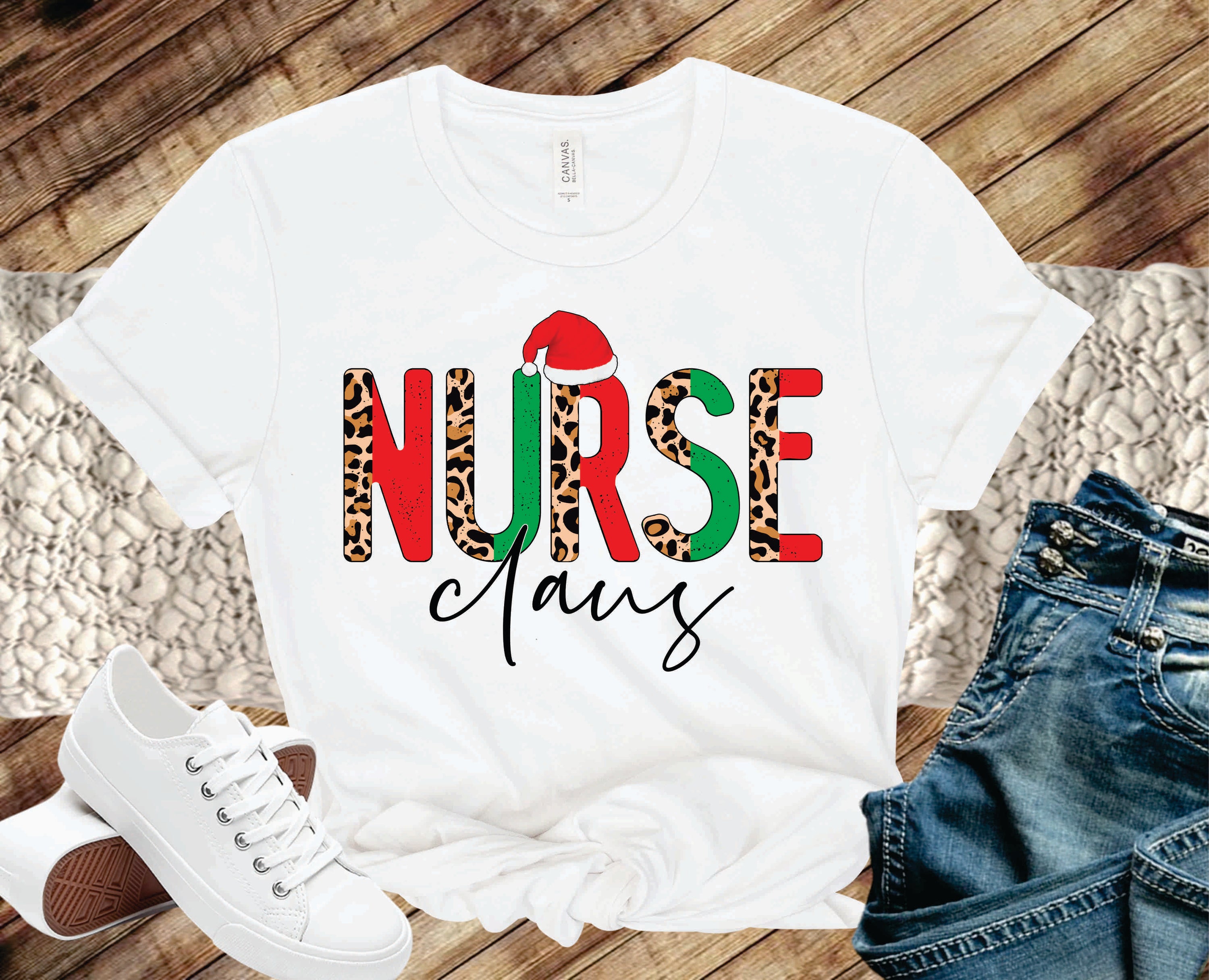 Nurse Claus Half Leopard Graphic Tee featuring a festive design with a playful nurse graphic and trendy leopard print.