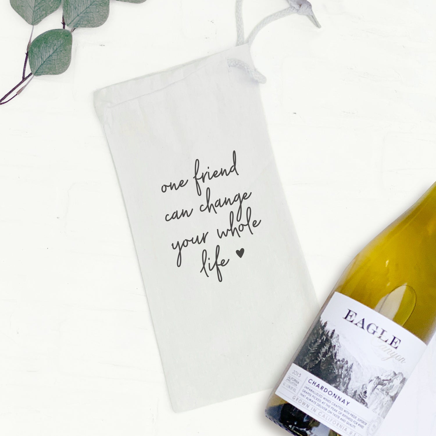 Stylish canvas wine bag with drawstring closure, perfect for gifting wine bottles.
