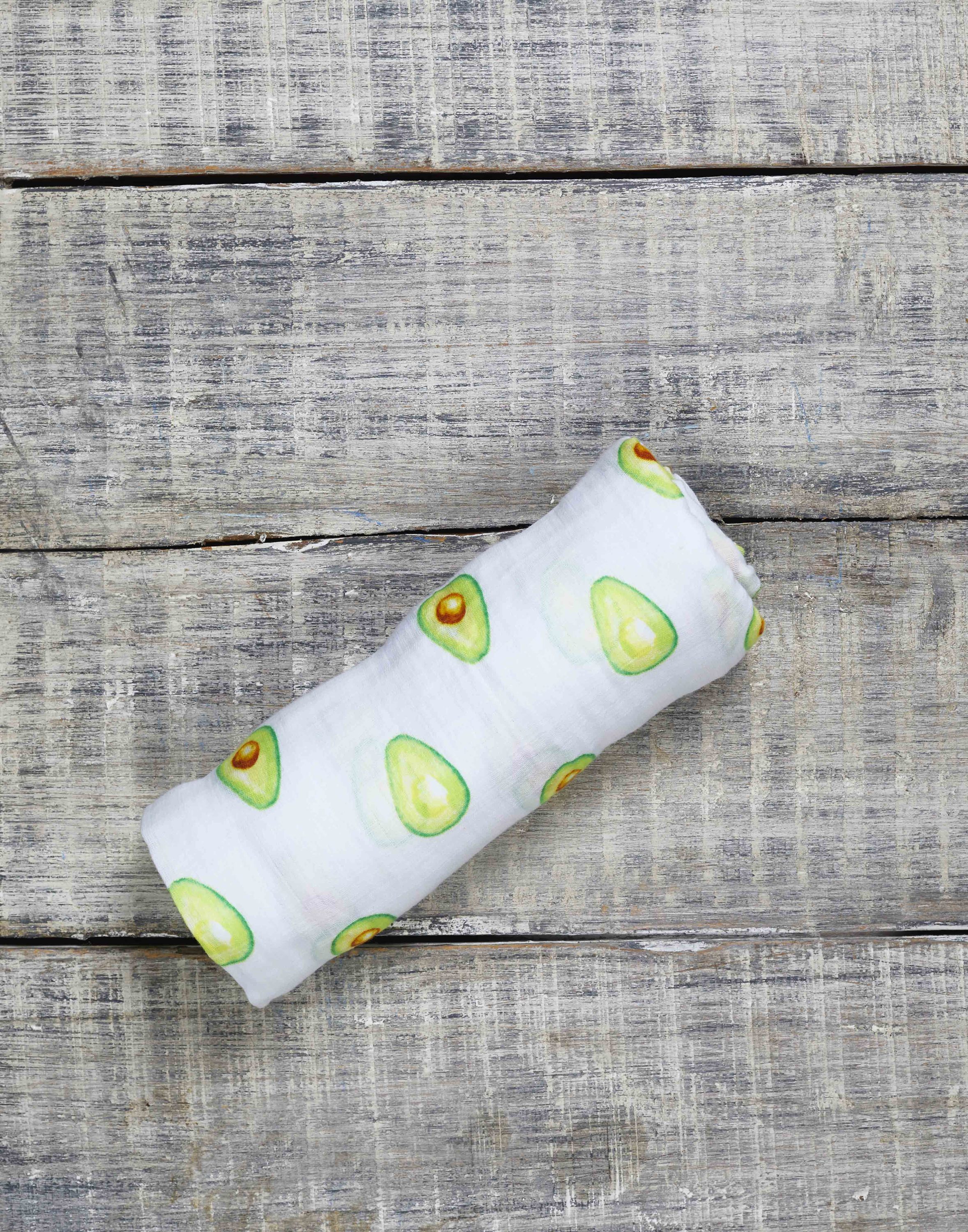 Luxuriously soft organic cotton swaddle in avocado color, perfect for wrapping babies comfortably.