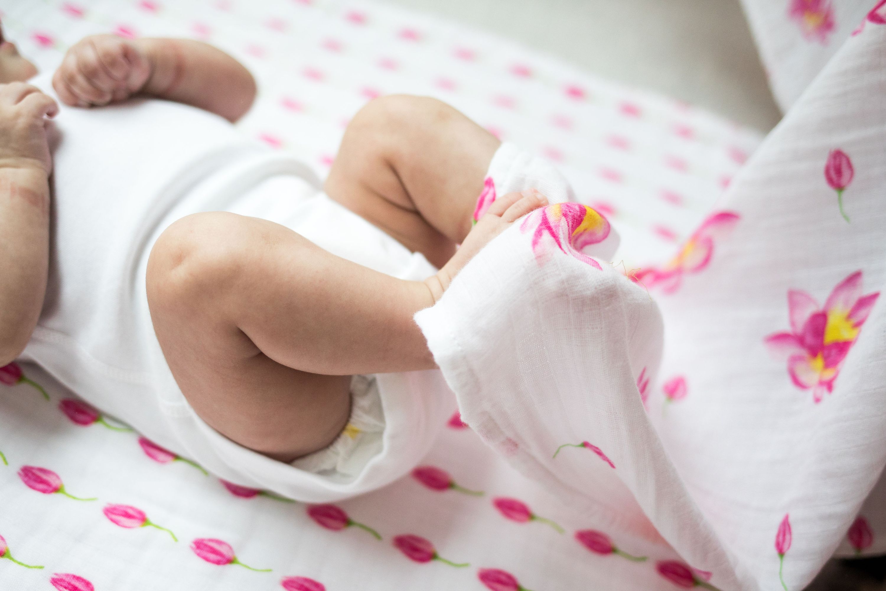 Organic Swaddle - Flower Bud made from soft GOTS certified cotton, featuring a delicate floral design, perfect for wrapping babies comfortably.