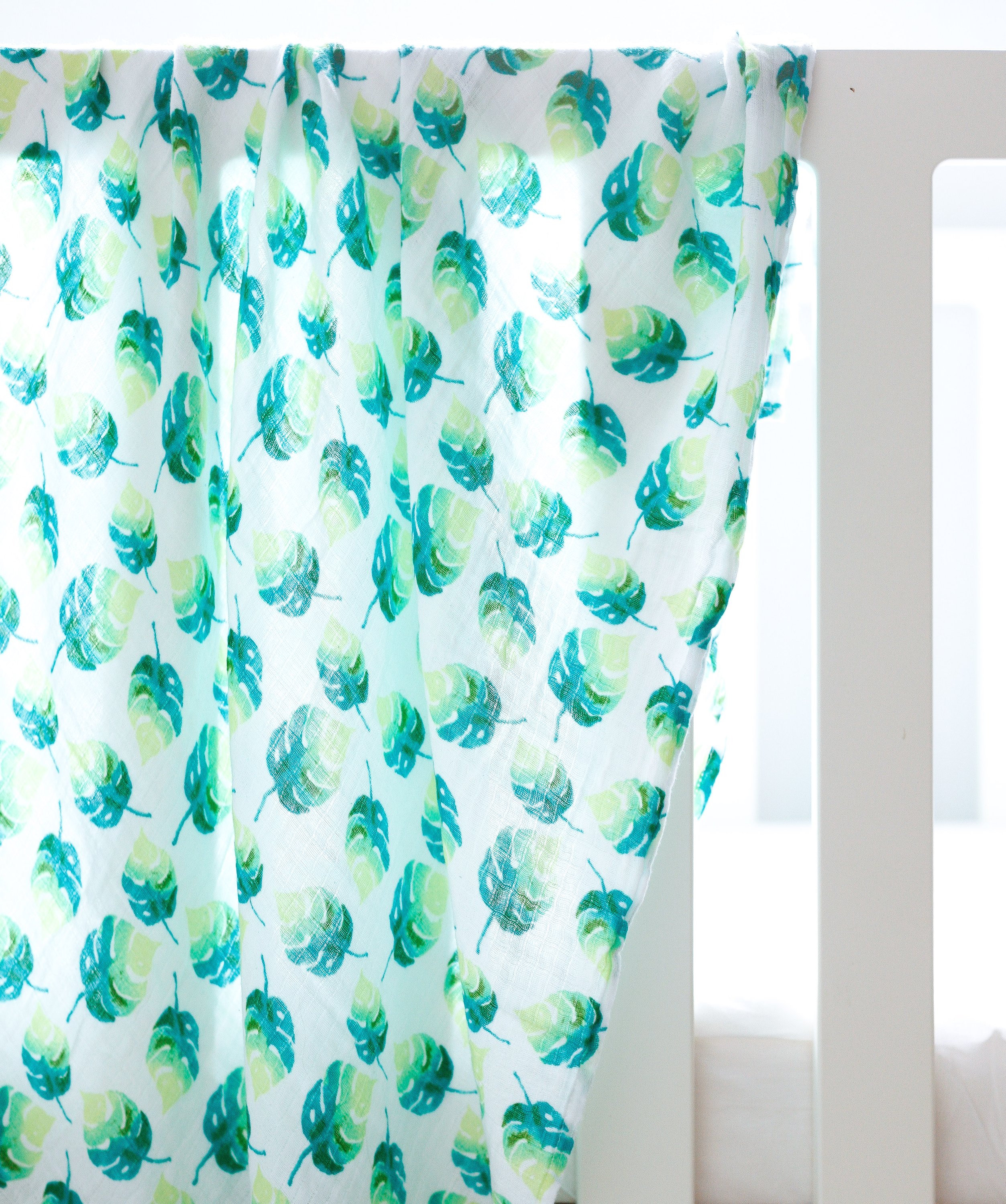 Organic Swaddle - Leaf made from soft GOTS certified cotton, featuring a beautiful leaf design, perfect for snuggling babies.