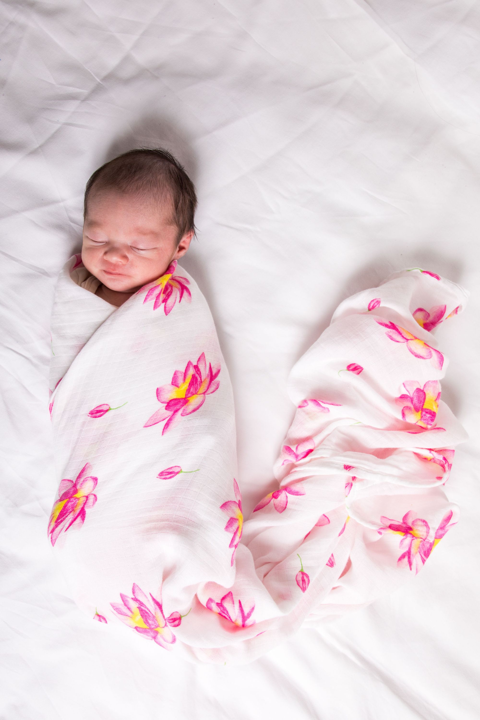 Organic Swaddle - Magical Lotus made from soft GOTS certified cotton, featuring a beautiful lotus design, perfect for snuggling babies.
