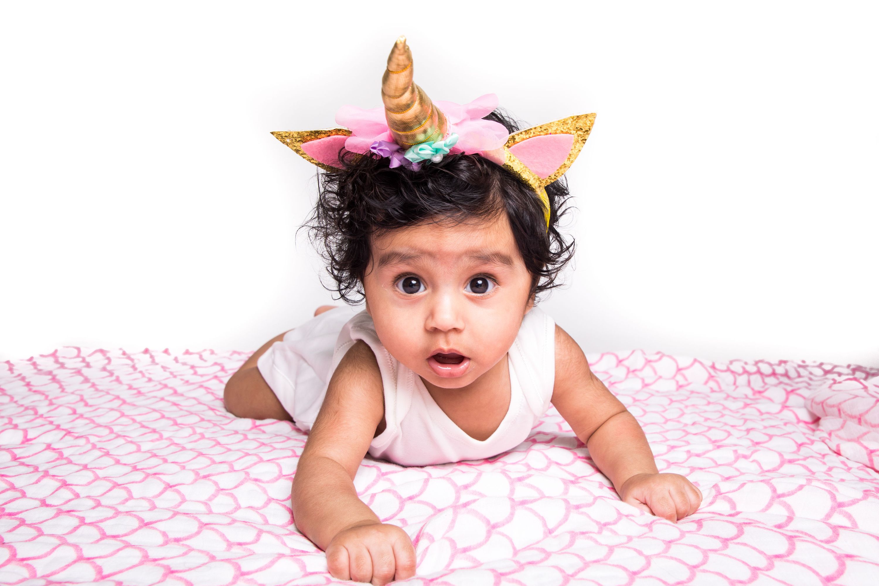 Organic Swaddle in Pink Rainbow, made from soft GOTS certified cotton, featuring a vibrant rainbow design.