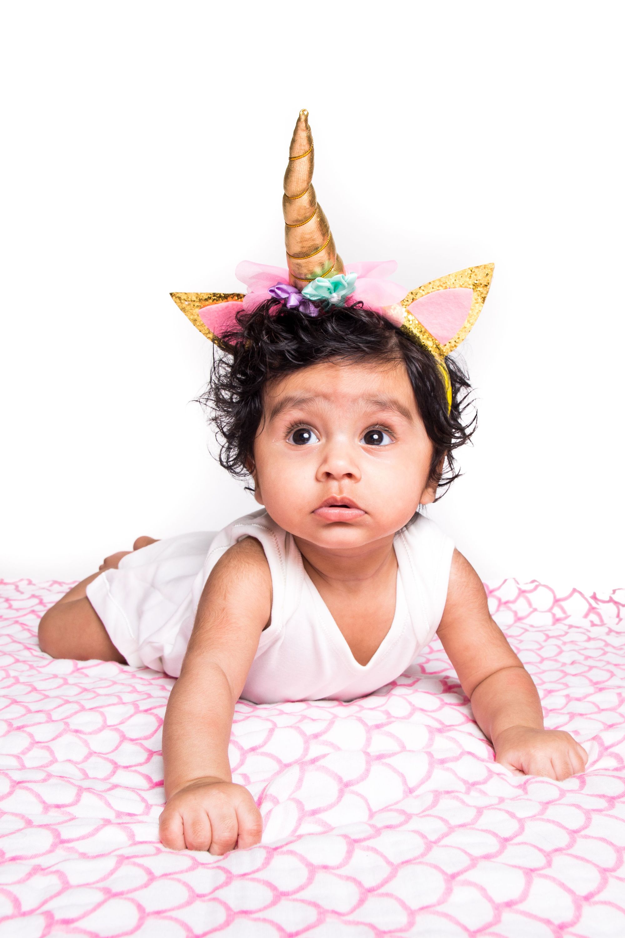 Organic Swaddle in Pink Rainbow, made from soft GOTS certified cotton, featuring a vibrant rainbow design.