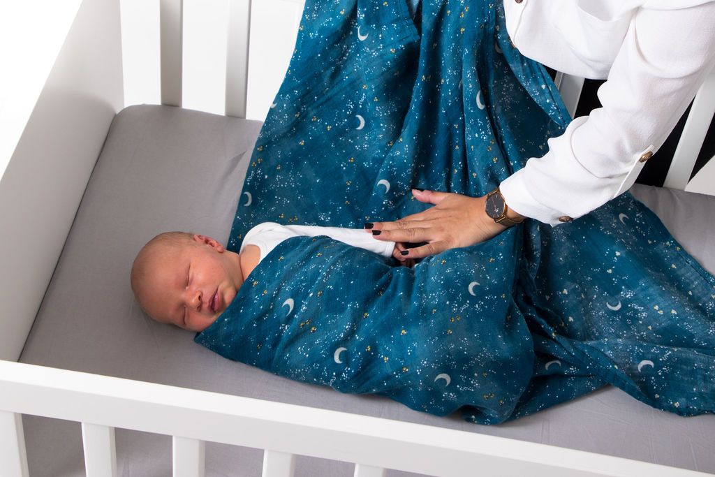 Organic Swaddle Set featuring starry night and hot air balloon designs, made from soft cotton, perfect for baby comfort.