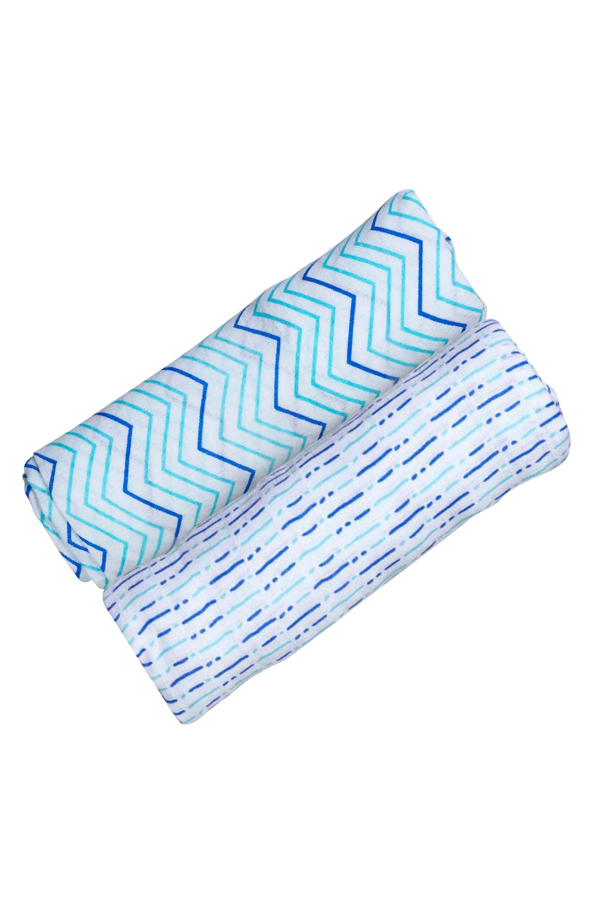 Organic Swaddle Set in Shades of Blue featuring chevron and dotty designs, made from soft cotton, perfect for baby snuggling.
