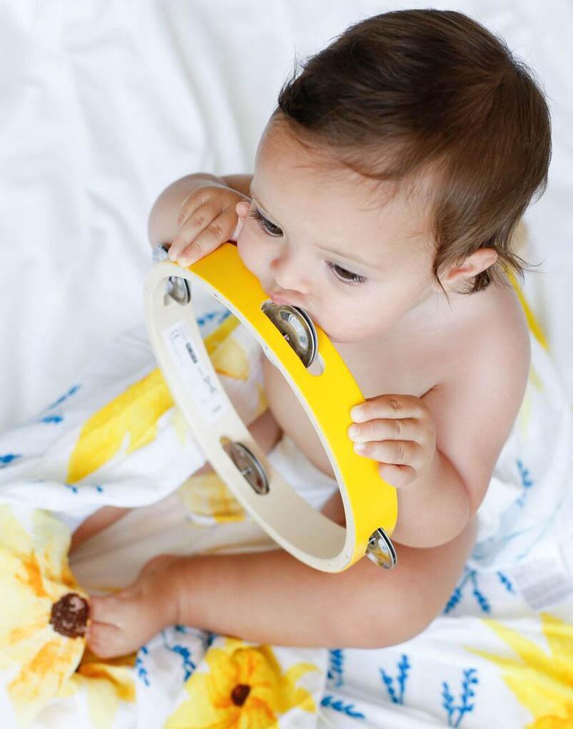 Organic Swaddle in Sunflower design, made from soft GOTS certified cotton, perfect for snuggling and versatile use.